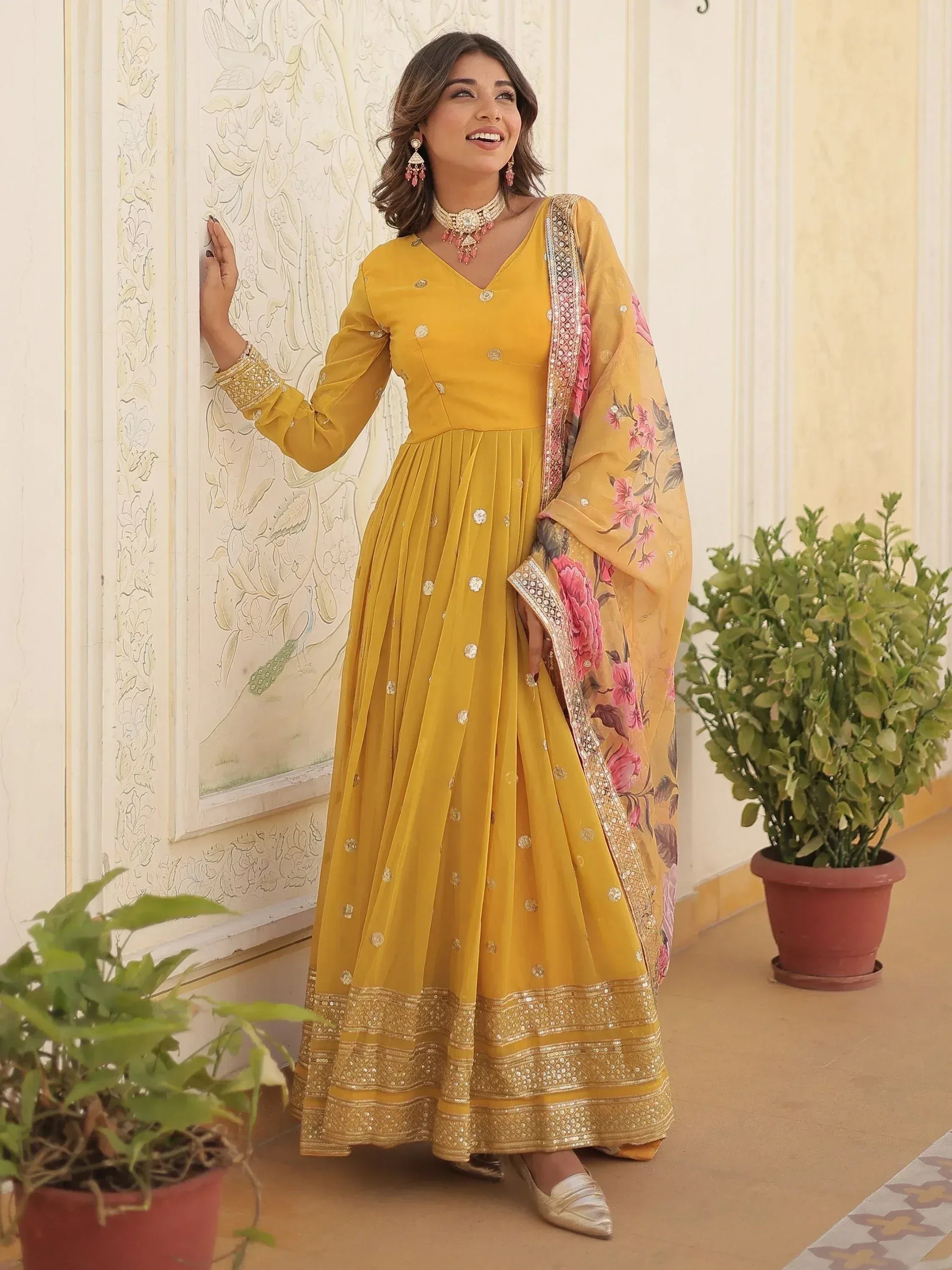 Yellow ethnic anarkali suit with floral dupatta, perfect for Indian weddings and festive occasions