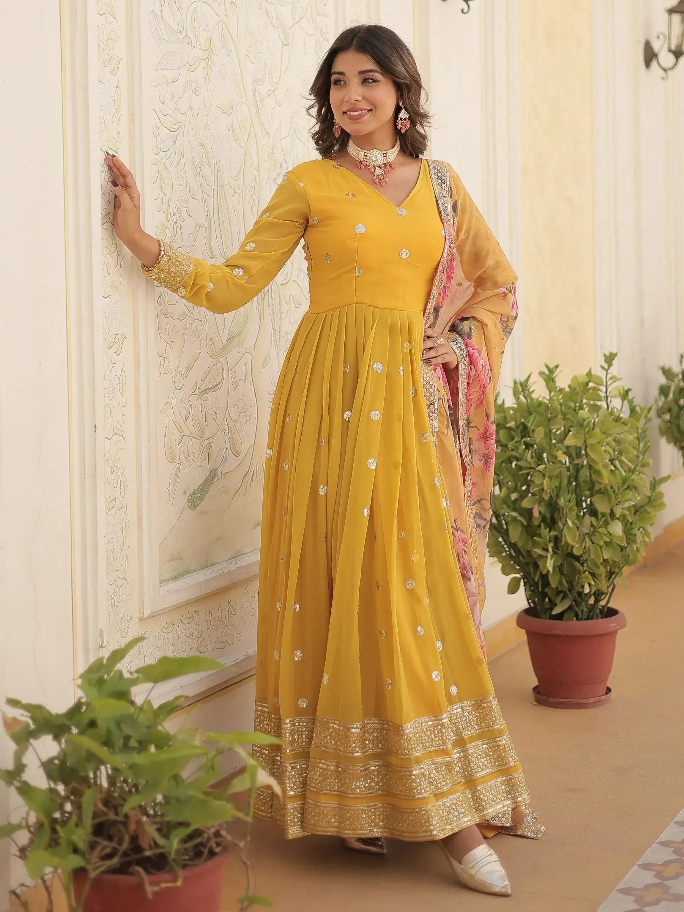 Yellow ethnic anarkali suit with gold embroidery and floral dupatta, perfect for Indian occasions
