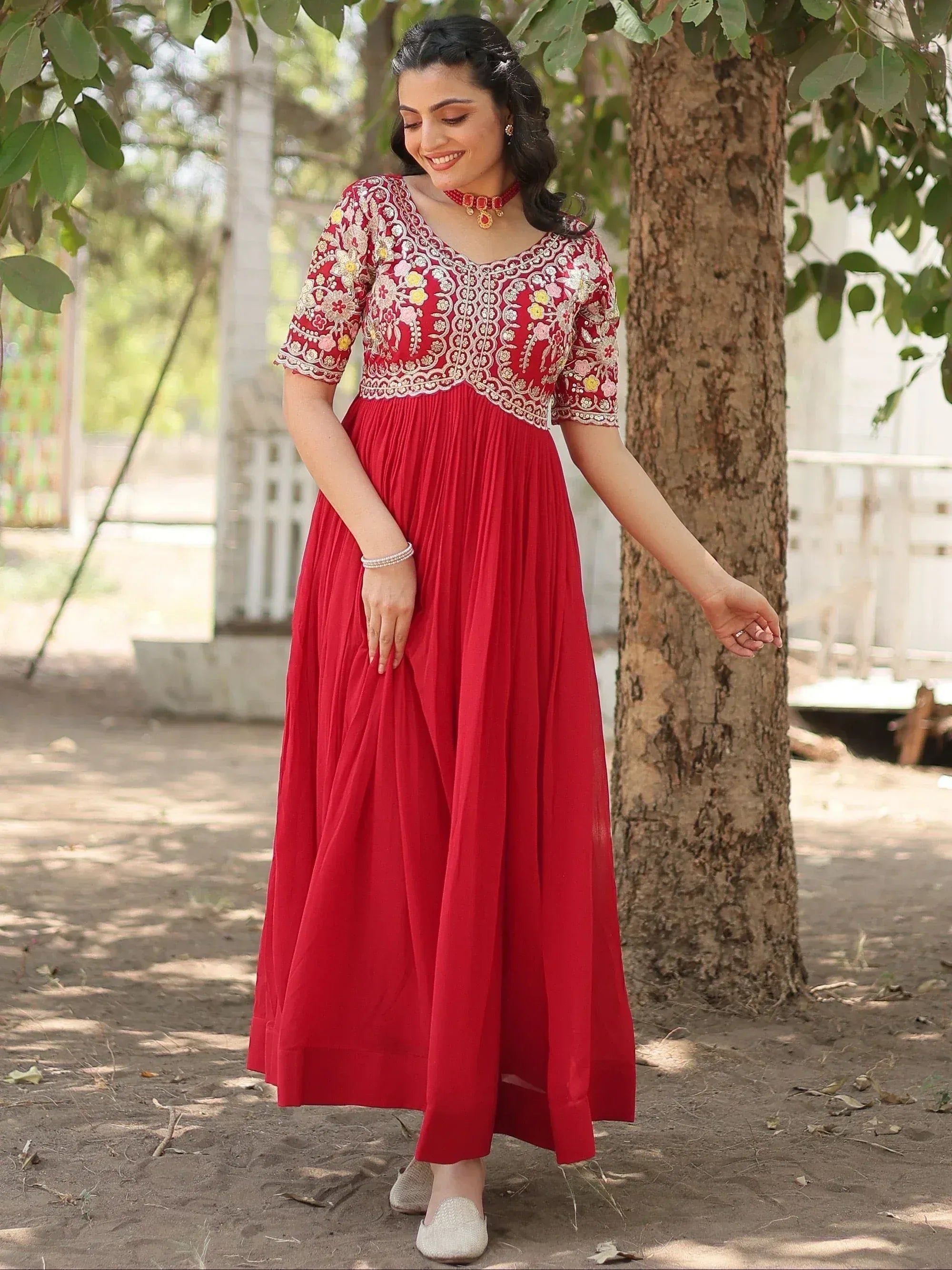 Red embroidered ethnic gown with floral detailing, perfect for Indian festive occasions and weddings