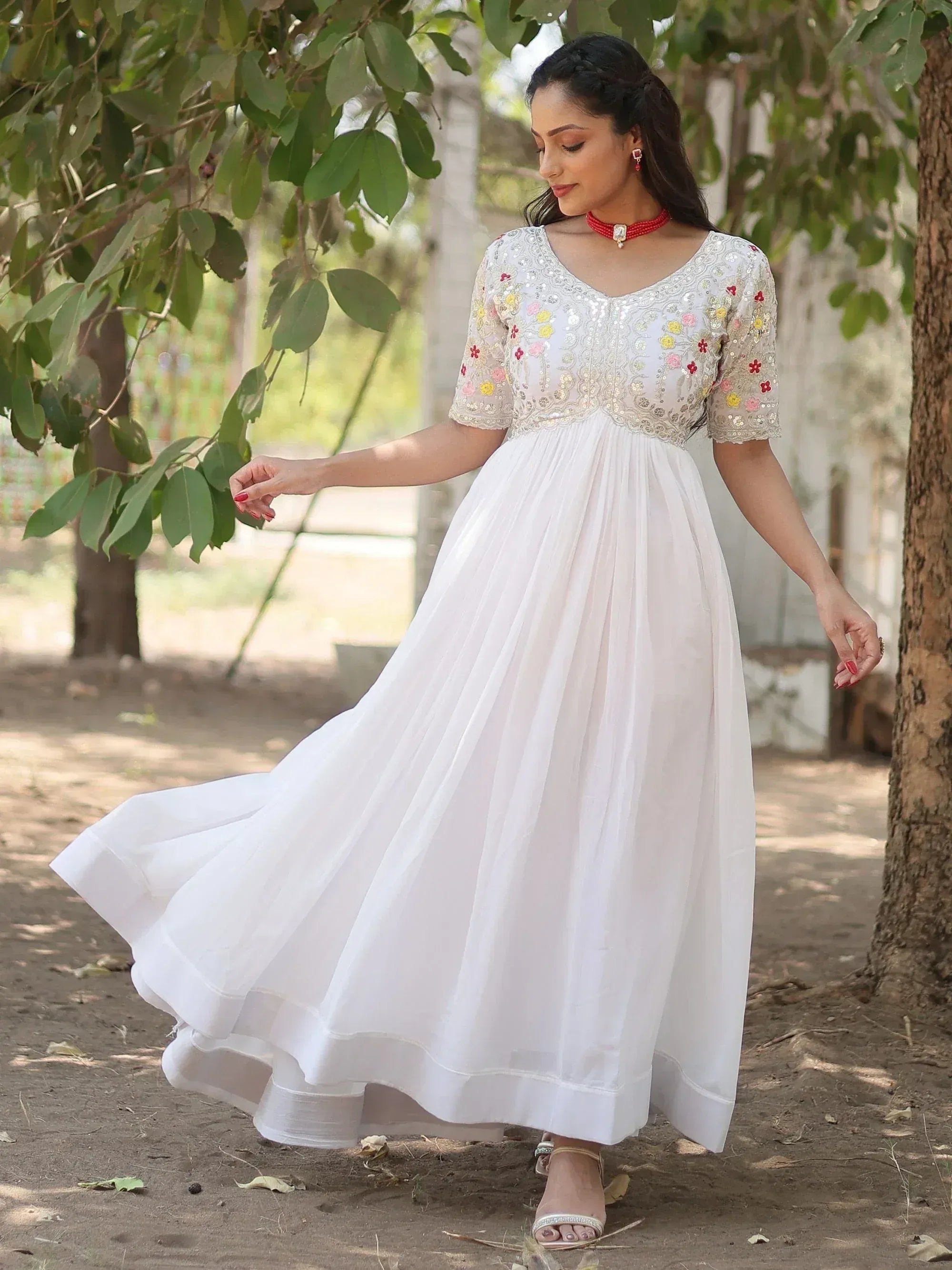 White ethnic gown with floral embroidery, perfect for Indian occasions and festive wear