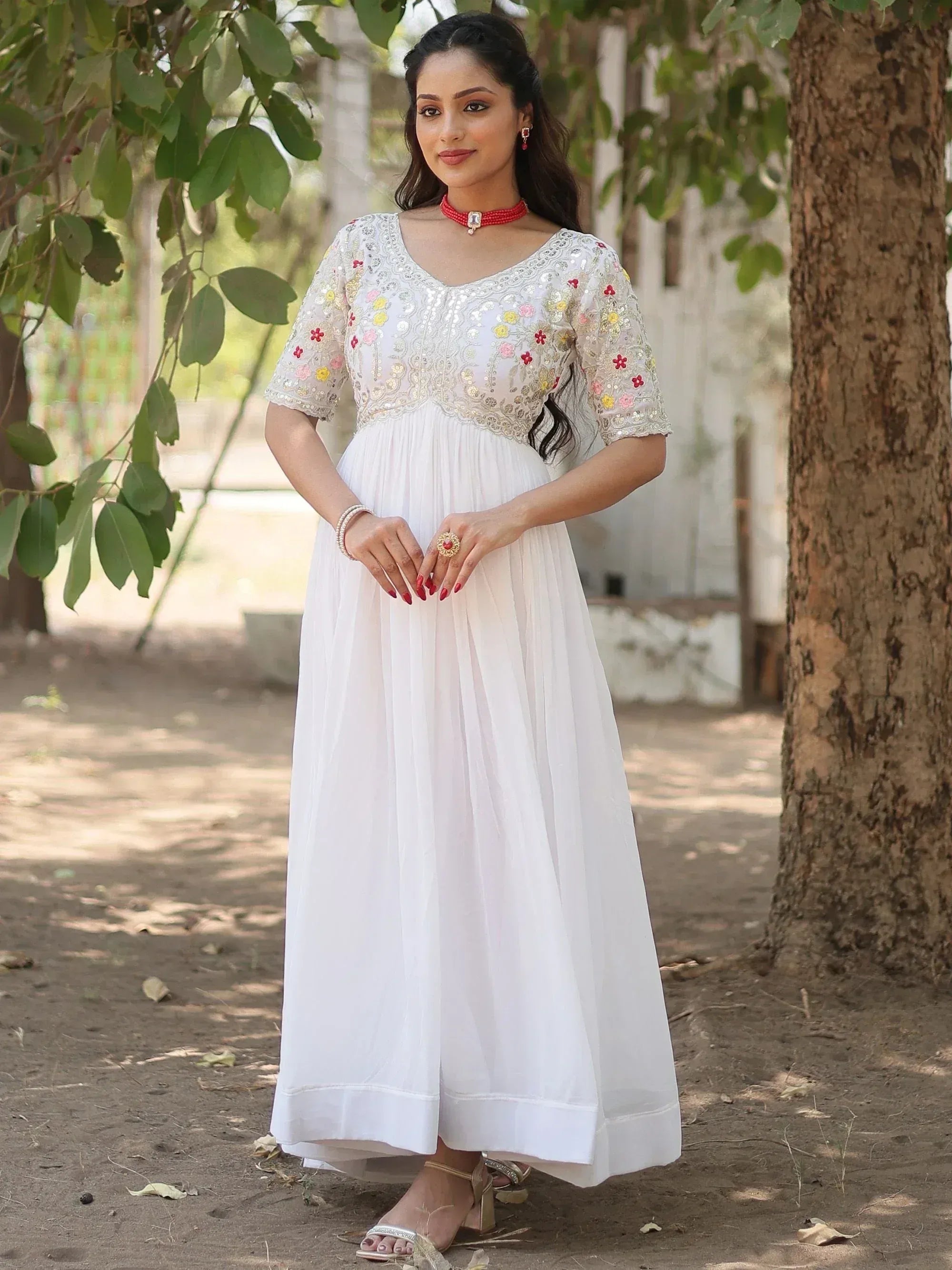 White ethnic gown with floral embroidery, perfect for Indian occasions and festive wear.