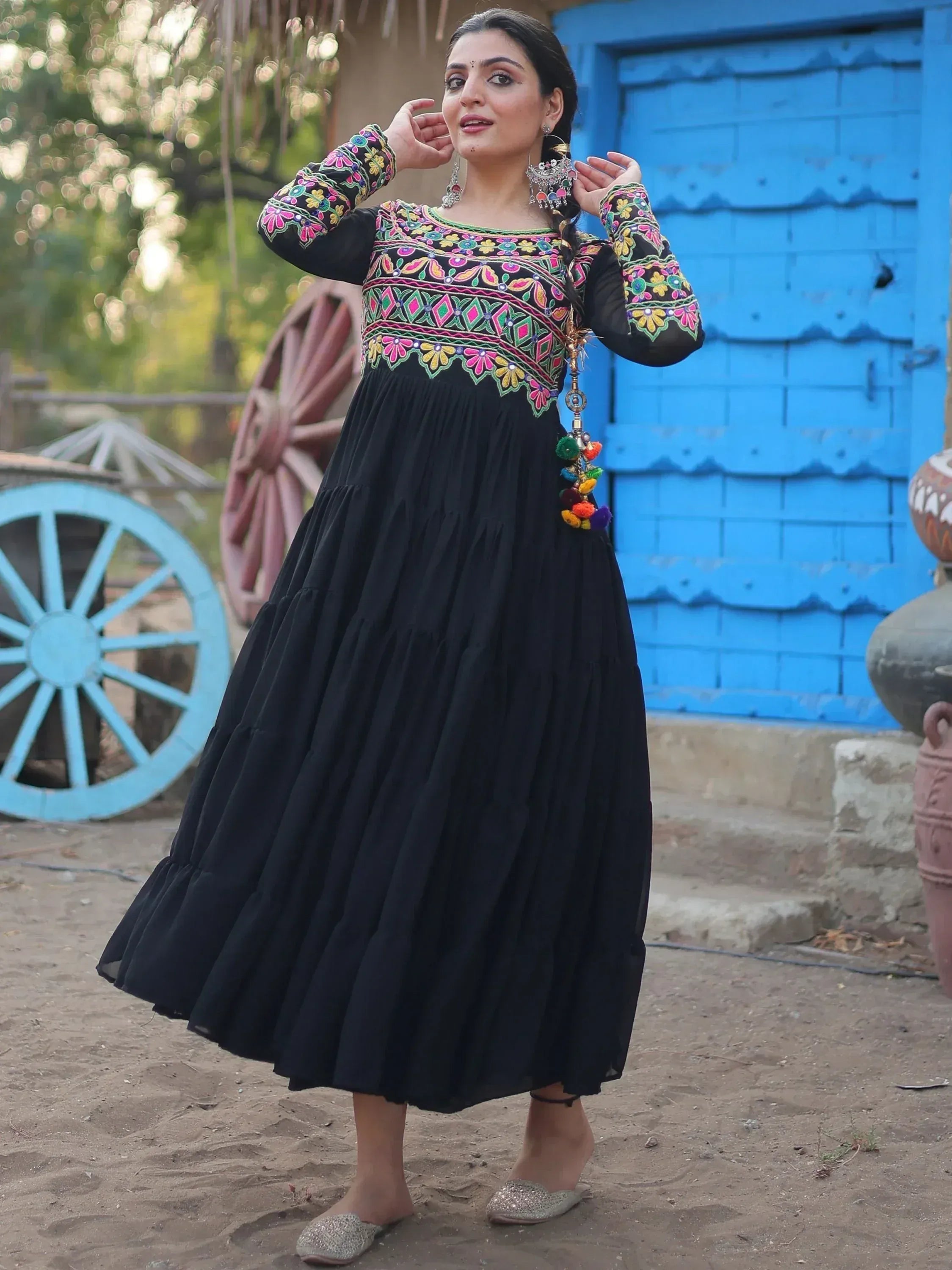 Black ethnic gown with colorful floral embroidery, perfect for Indian festive wear and traditional occasions.