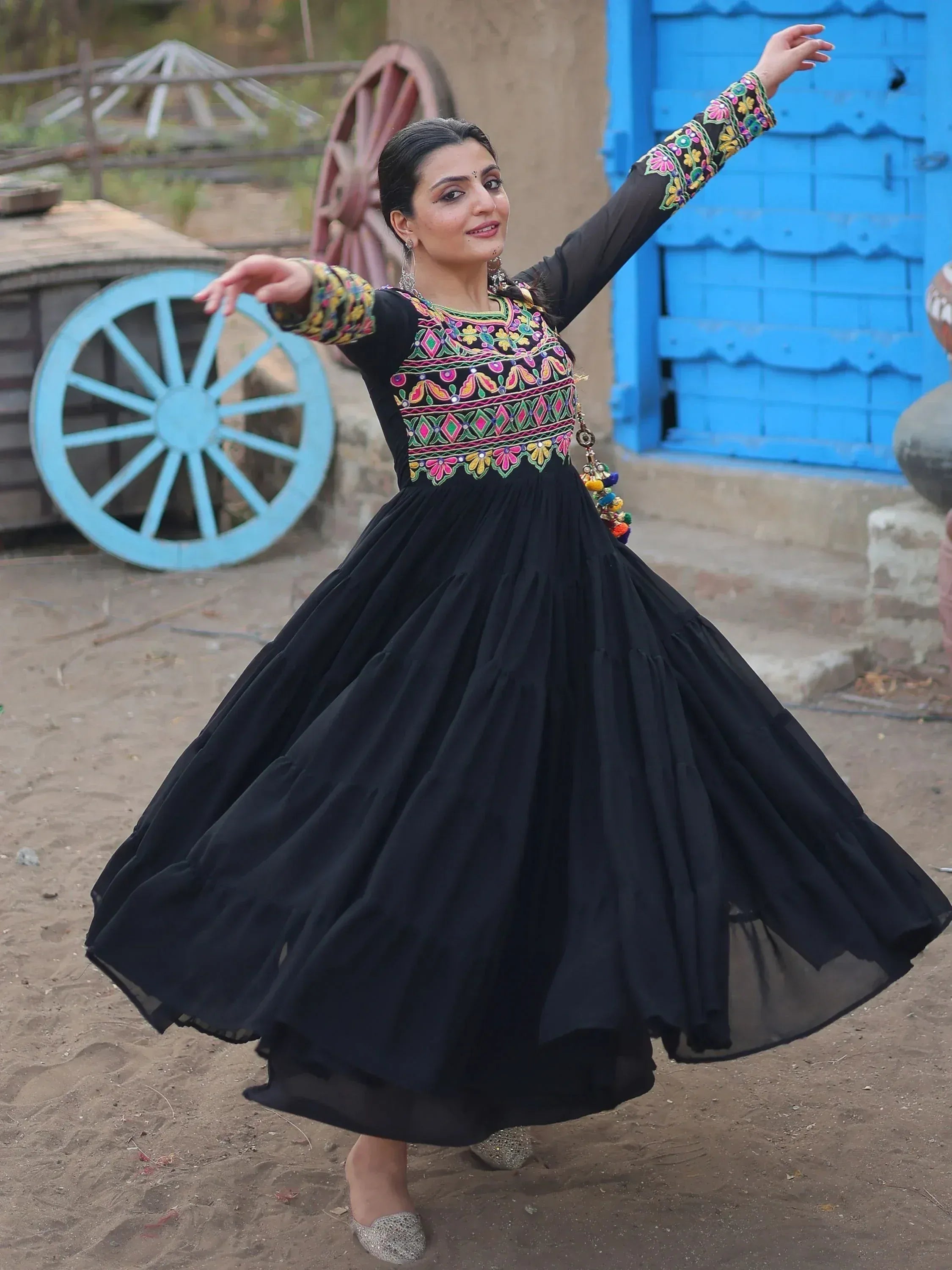 Black ethnic gown with colorful embroidery, perfect for Indian festive occasions and traditional wear.