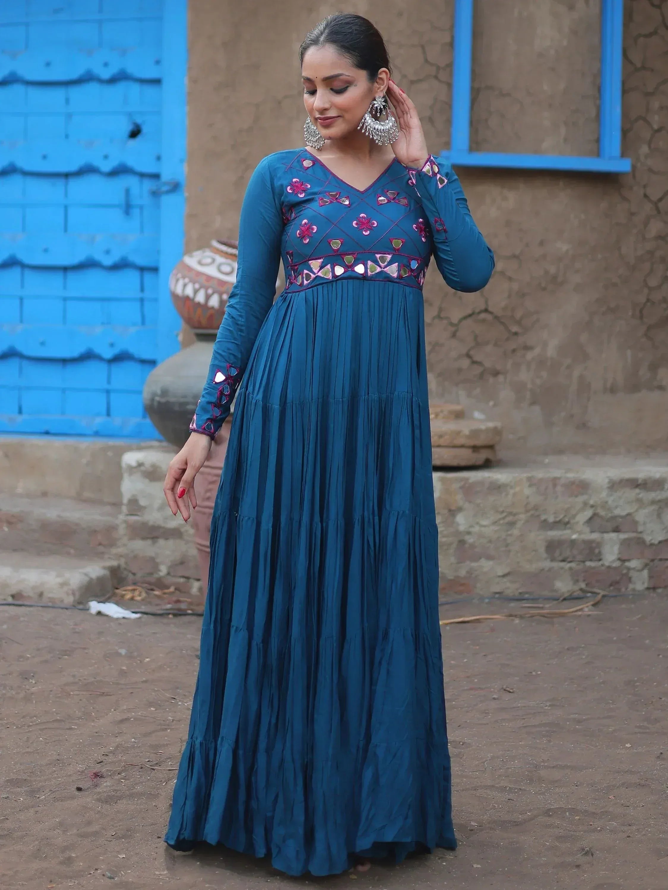 Teal ethnic gown with mirror work and floral embroidery, perfect for Indian festive occasions