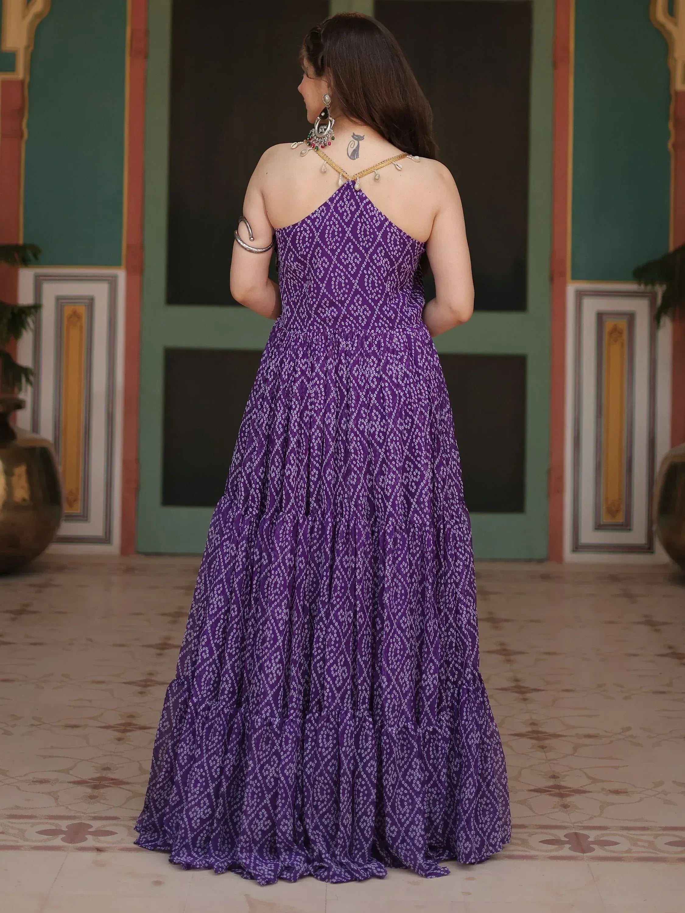 Purple printed ethnic gown with backless design, perfect for Indian occasions and festive wear