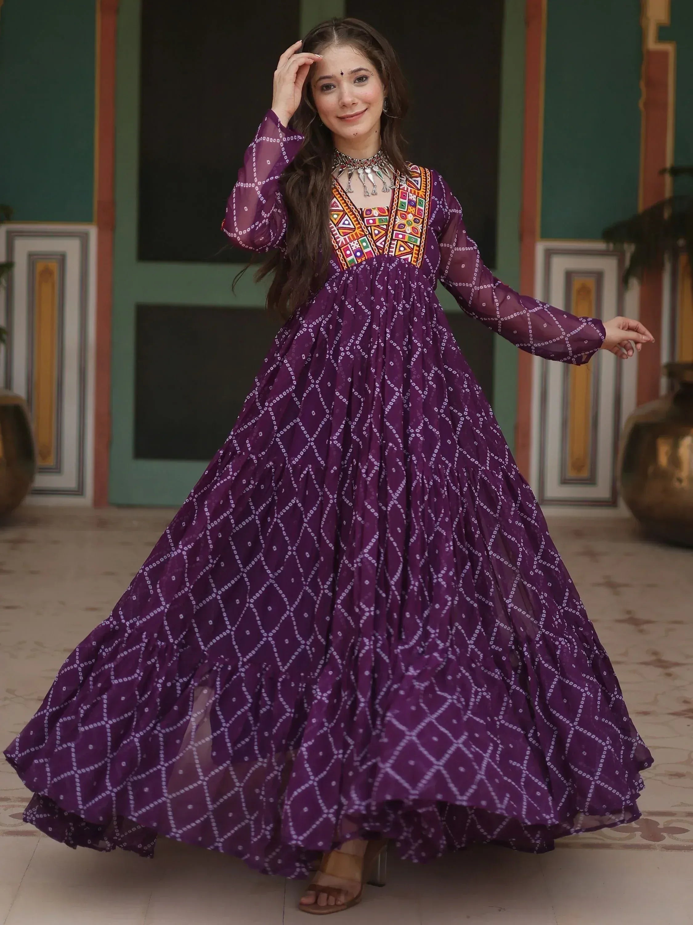 Purple ethnic gown with colorful embroidery and bandhani print, perfect for Indian festive occasions