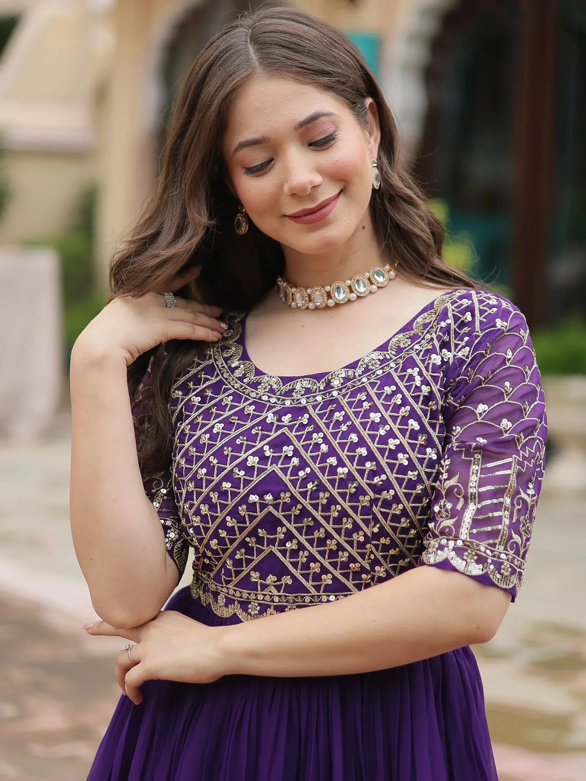 Purple ethnic gown with gold embroidery, perfect for Indian occasions and festive wear