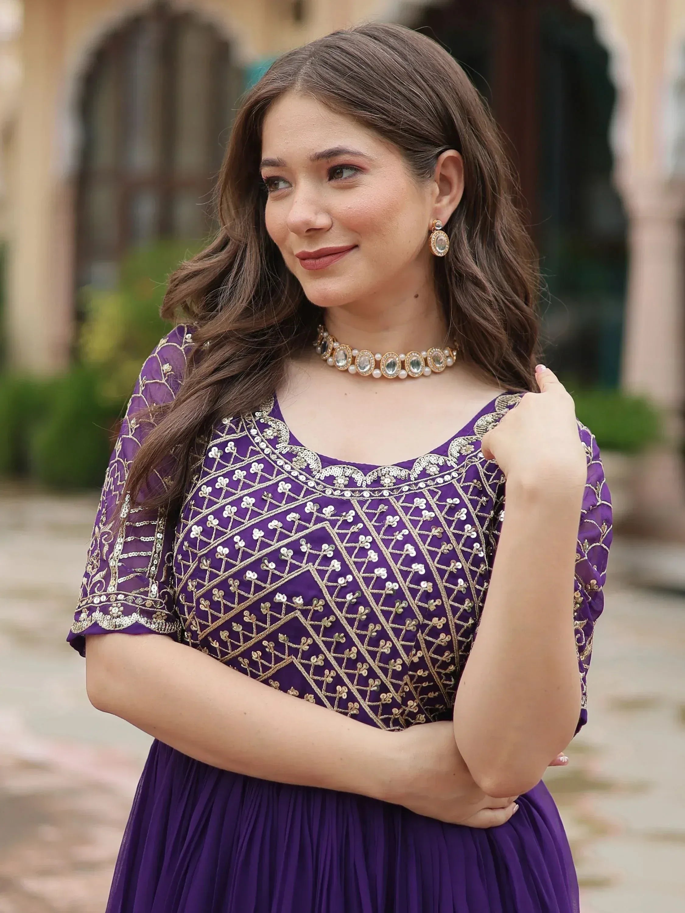 Purple ethnic gown with gold embroidery, perfect for Indian occasions and festive wear.