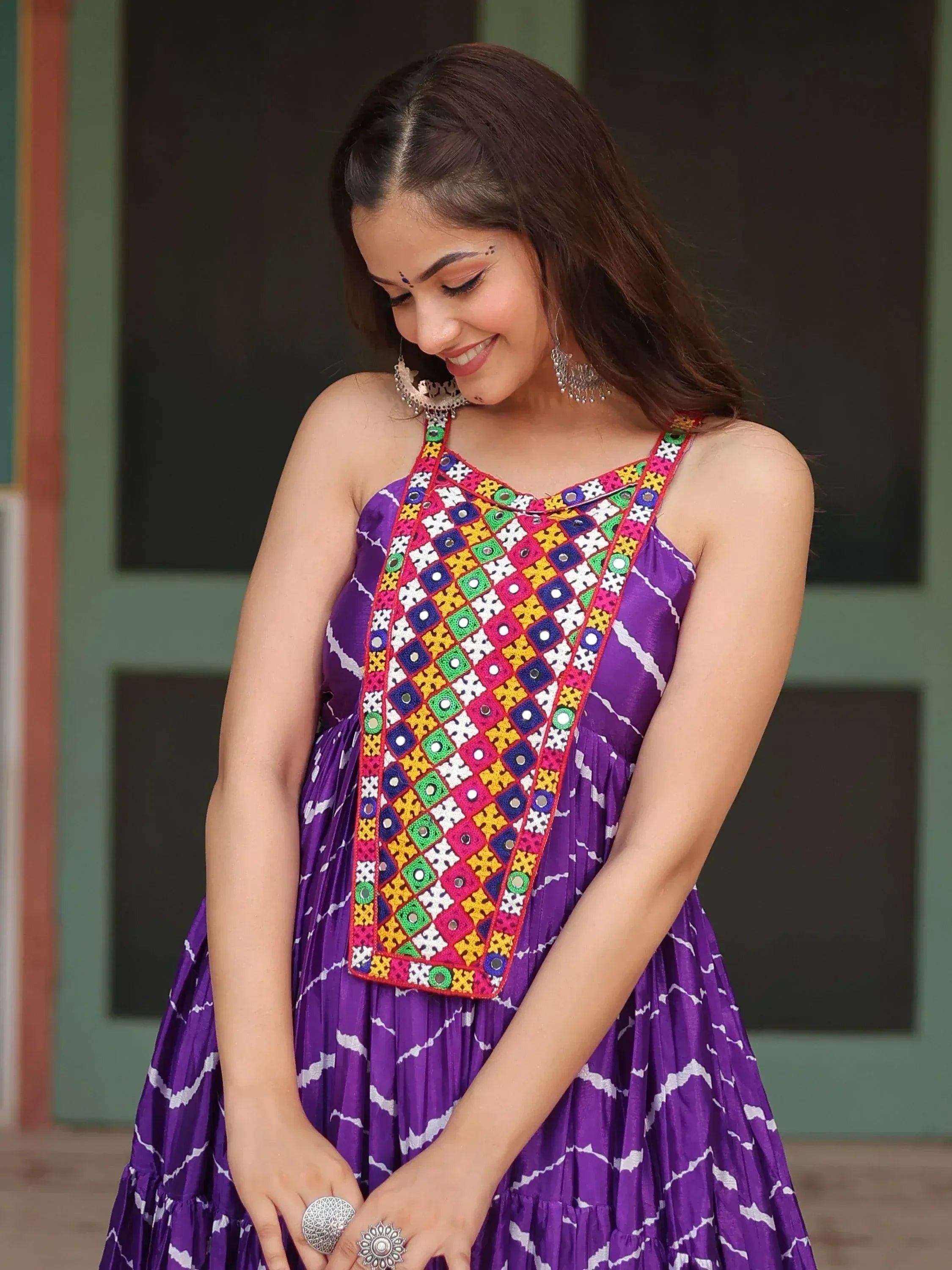 Purple ethnic gown with colorful mirror work and geometric print, perfect for festive occasions