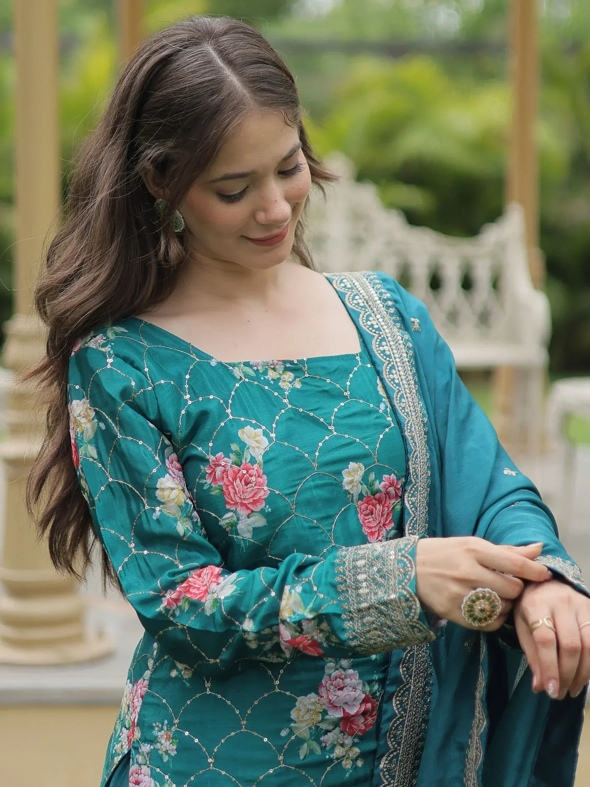 Teal floral embroidered salwar kameez with silver detailing, perfect for ethnic occasions