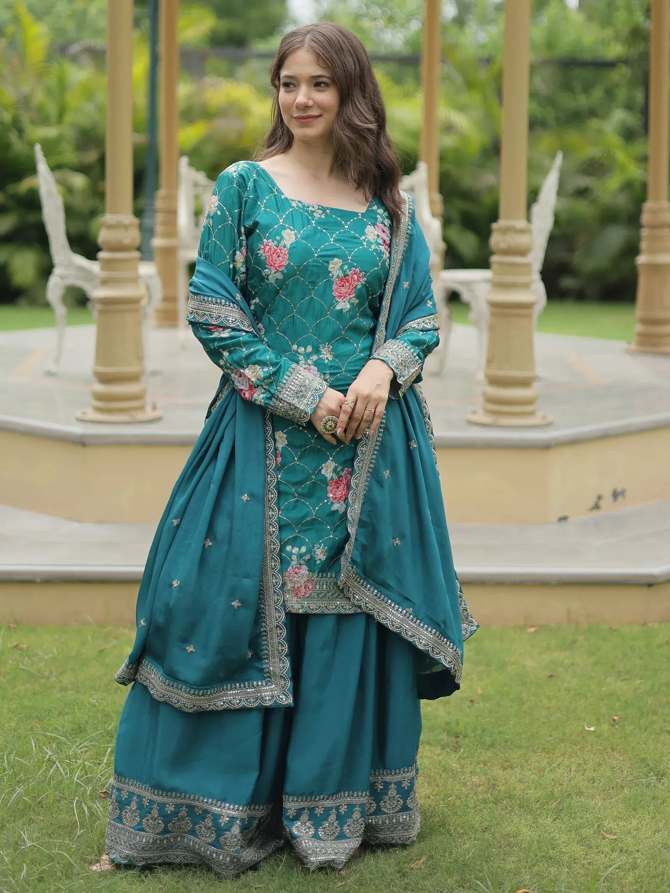 Teal floral embroidered salwar kameez with silver detailing, perfect for Indian ethnic wear occasions
