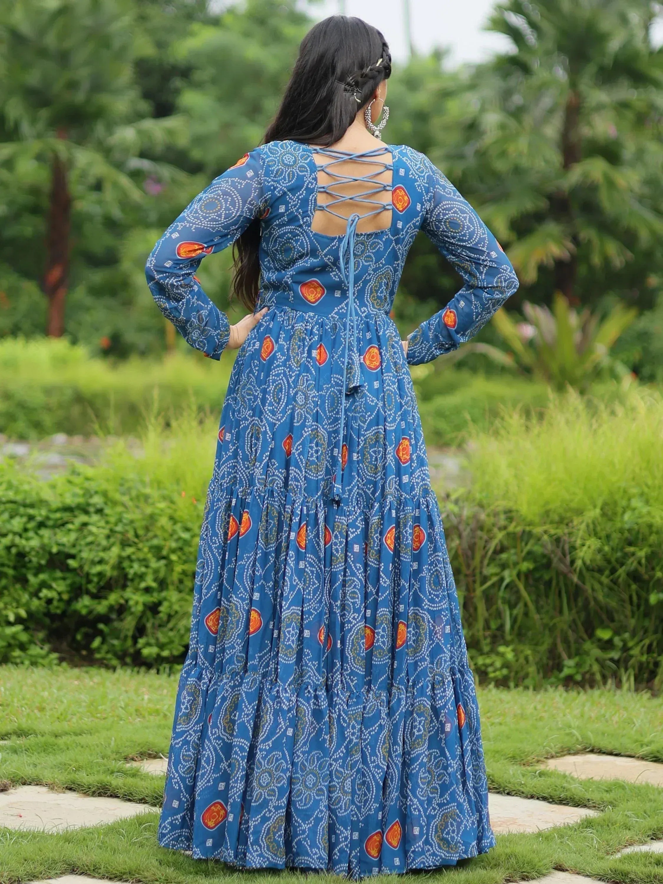 Blue printed ethnic gown with crisscross back design, perfect for Indian festive wear