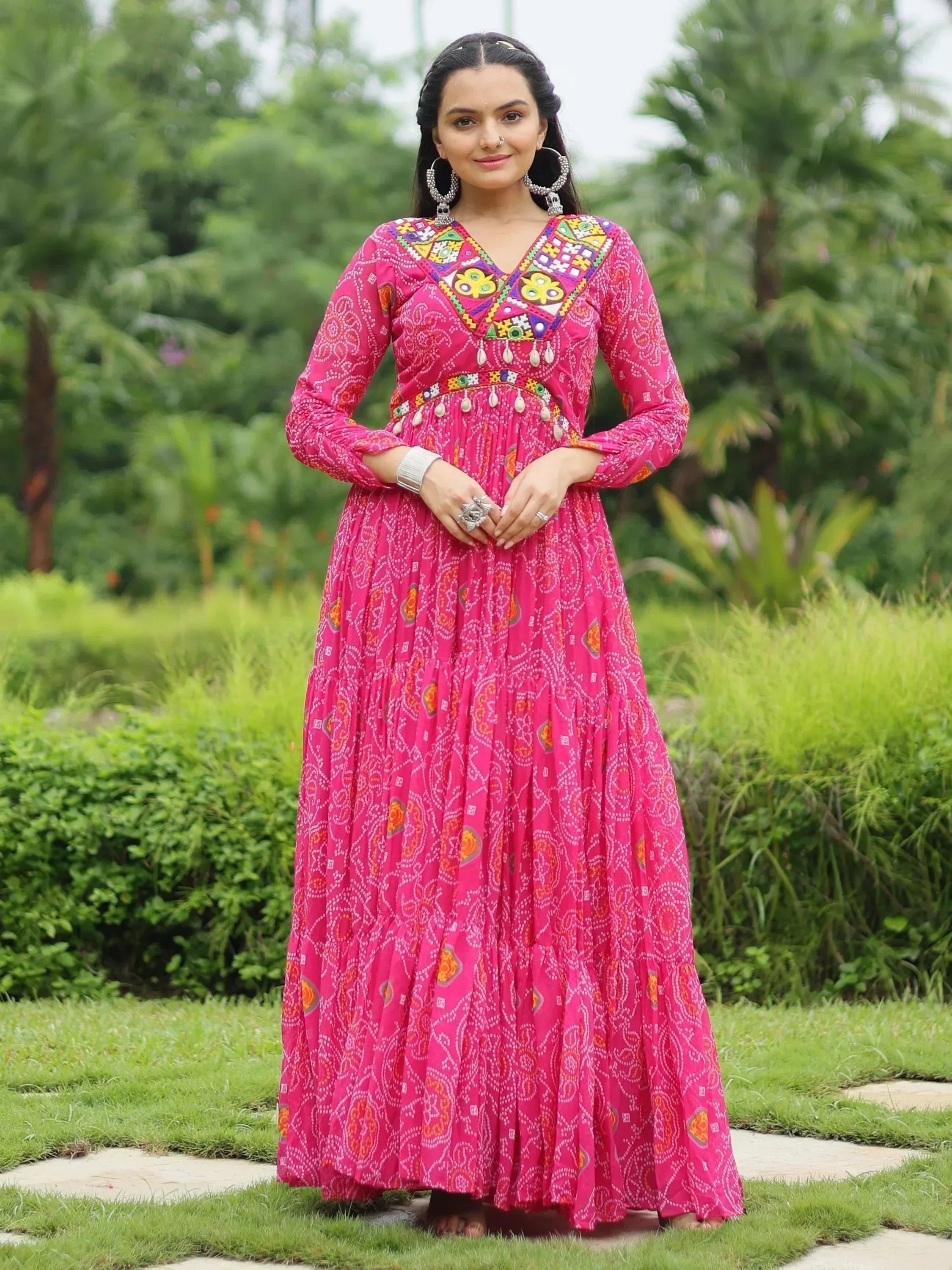 Pink ethnic gown with mirror work and bandhani print, perfect for Indian festivals and occasions