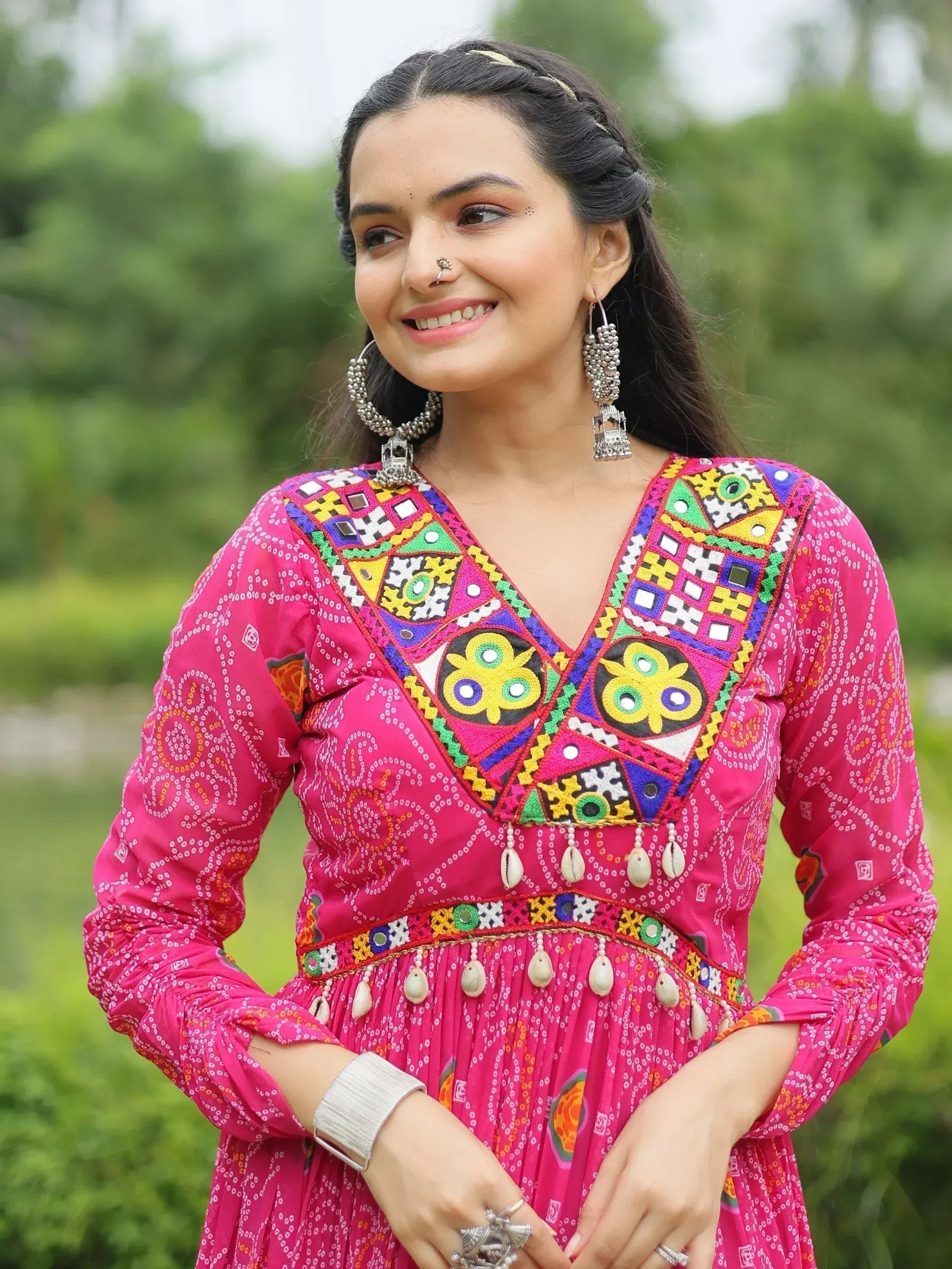 Pink embroidered ethnic gown with mirror work, perfect for Indian festive wear and traditional occasions.