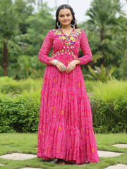 Woman in vibrant pink ethnic gown with mirror work, standing outdoors, Ethnic Plus fashion