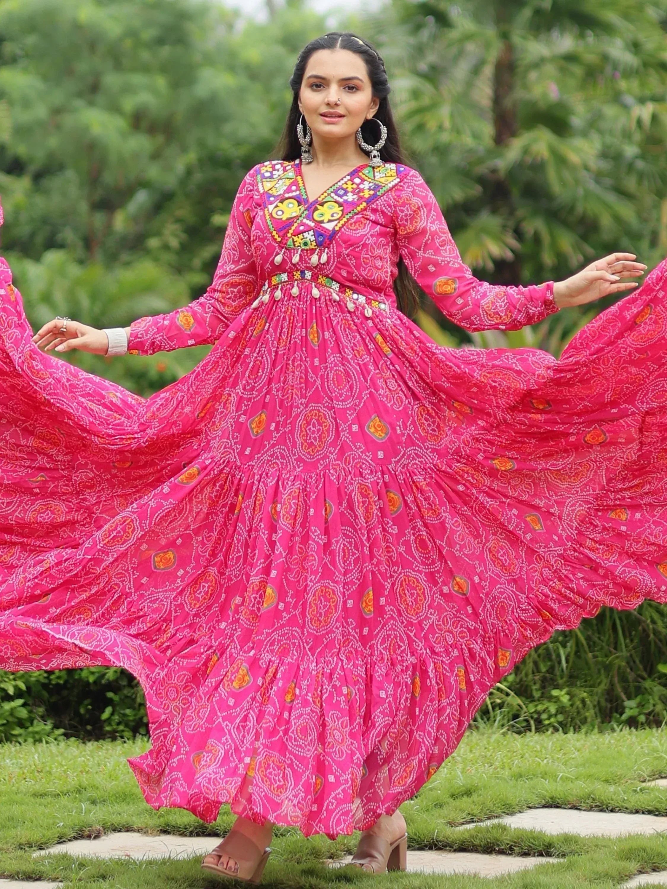 Pink ethnic gown with mirror work and bandhani print, perfect for festive occasions
