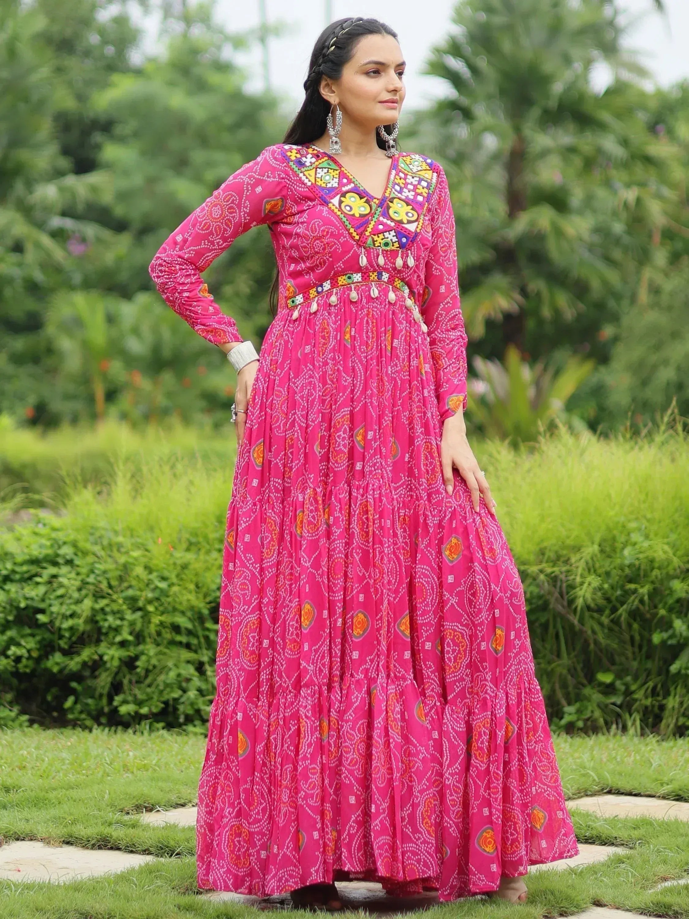 Pink ethnic gown with mirror work and bandhani print, perfect for festive occasions