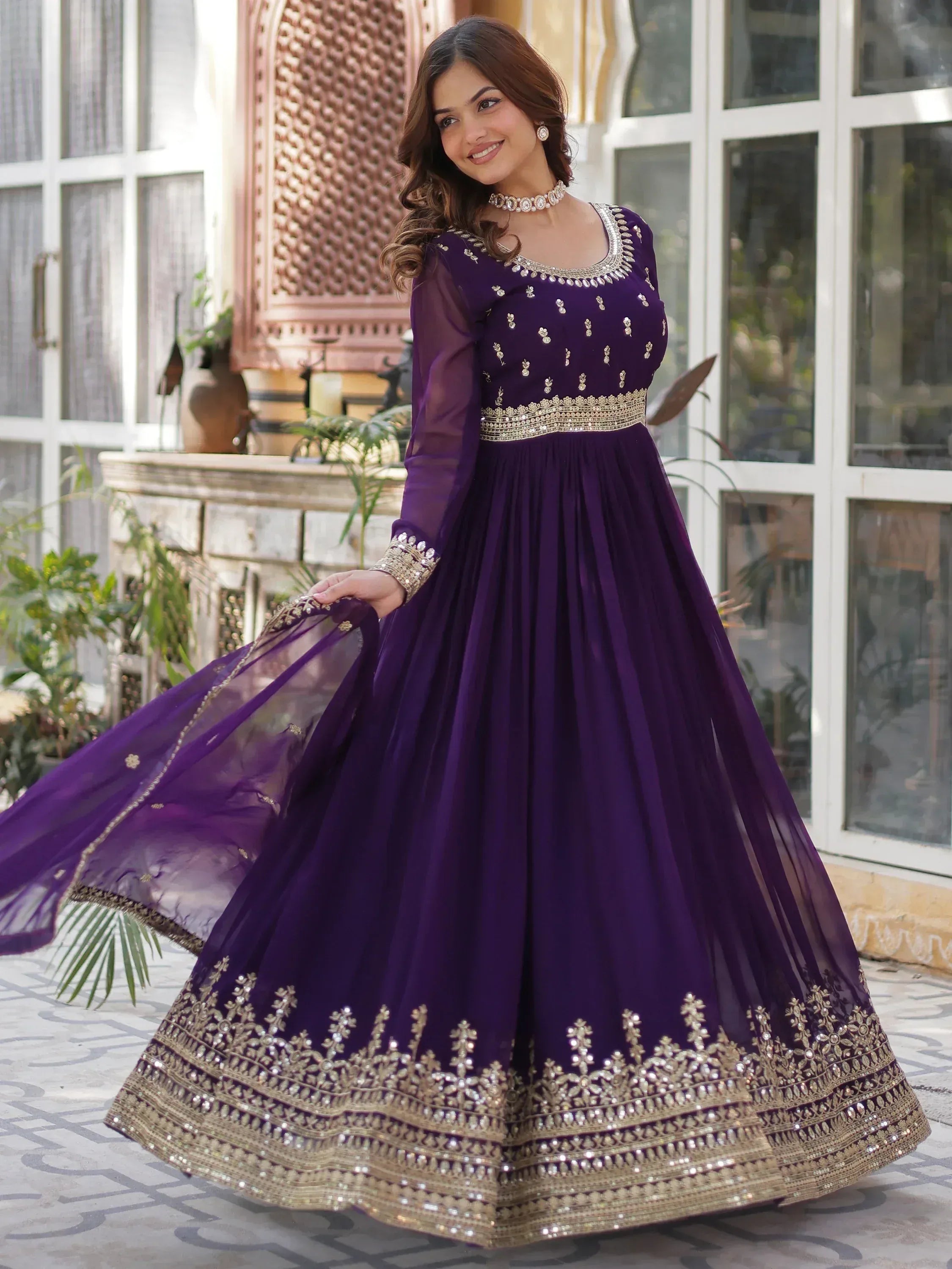 Purple ethnic gown with gold embroidery, perfect for Indian weddings and festive occasions