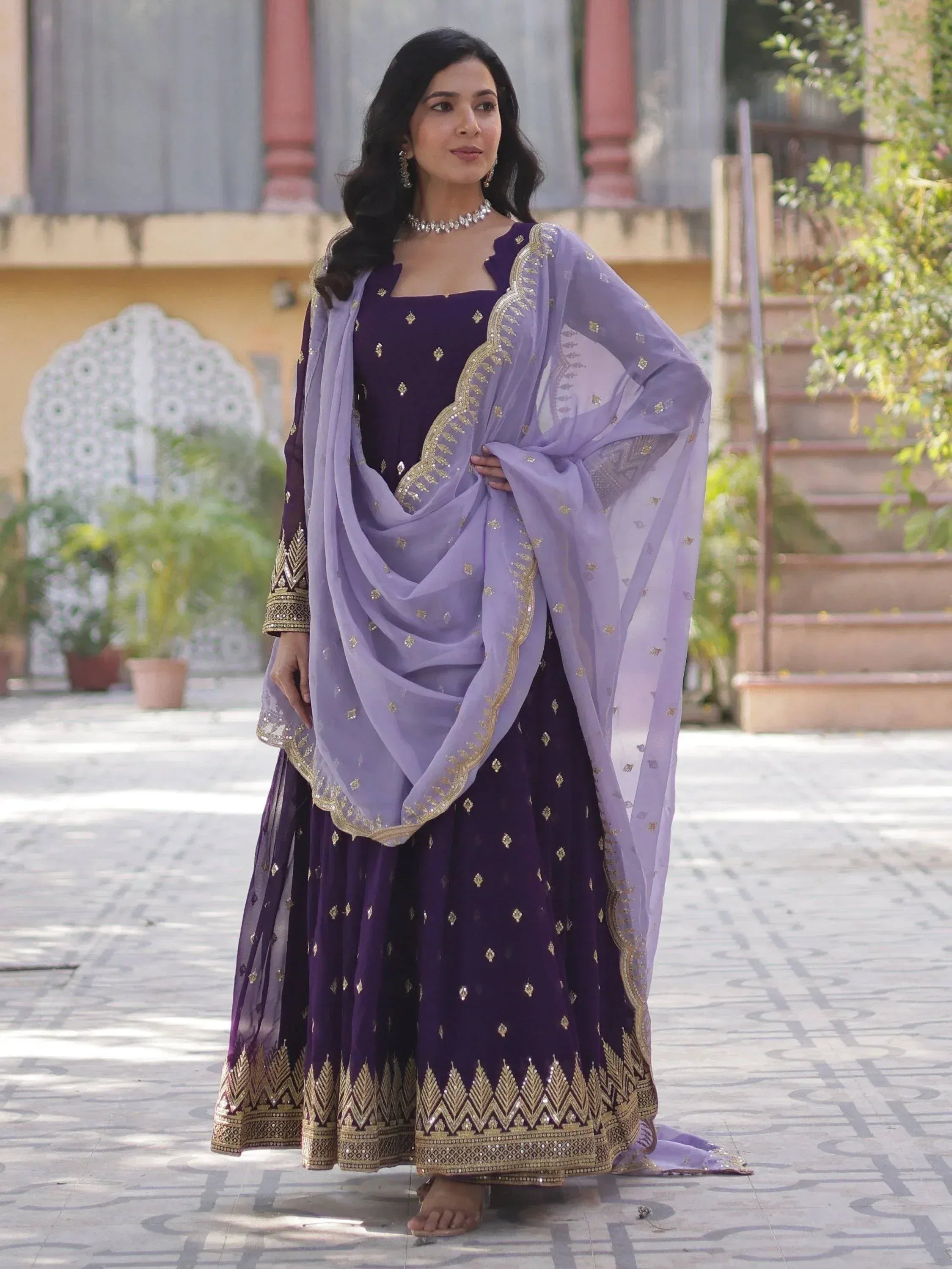 Purple ethnic salwar kameez with gold embroidery and lavender dupatta for festive occasions