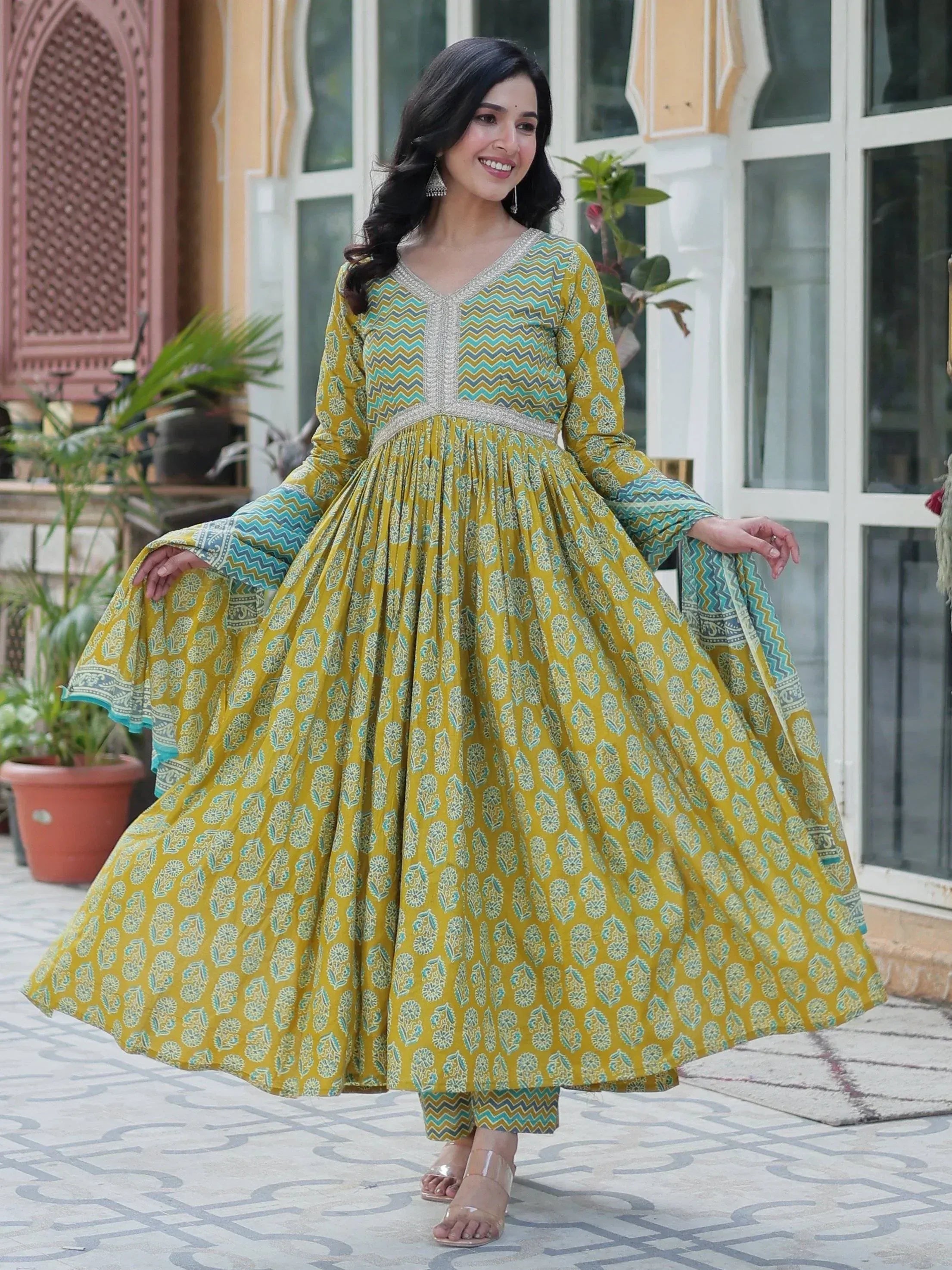 Yellow and teal printed Anarkali suit with flared skirt, perfect for ethnic occasions