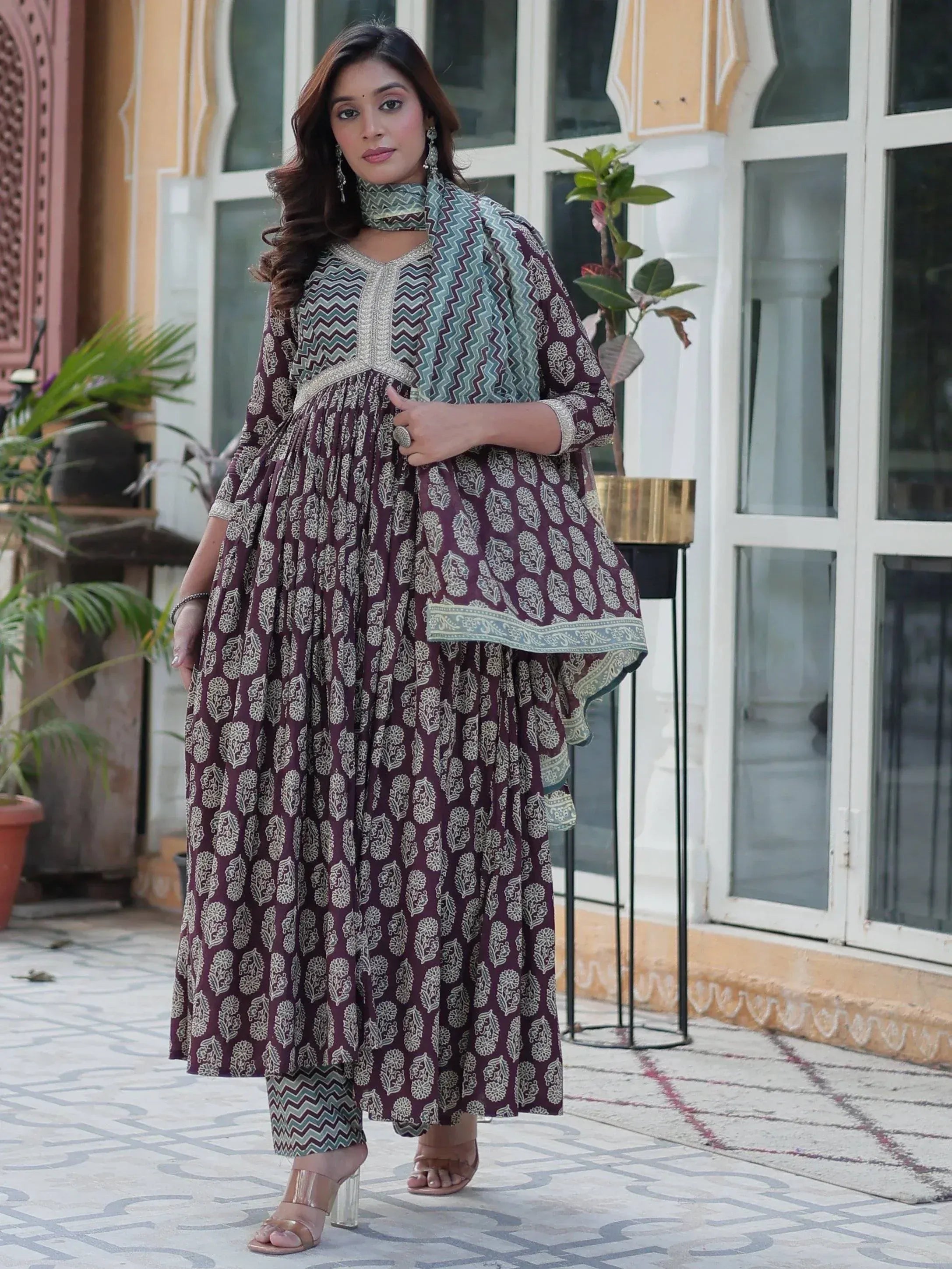 Woman in maroon printed ethnic kurta with matching palazzo and dupatta, ideal for Indian festive occasions