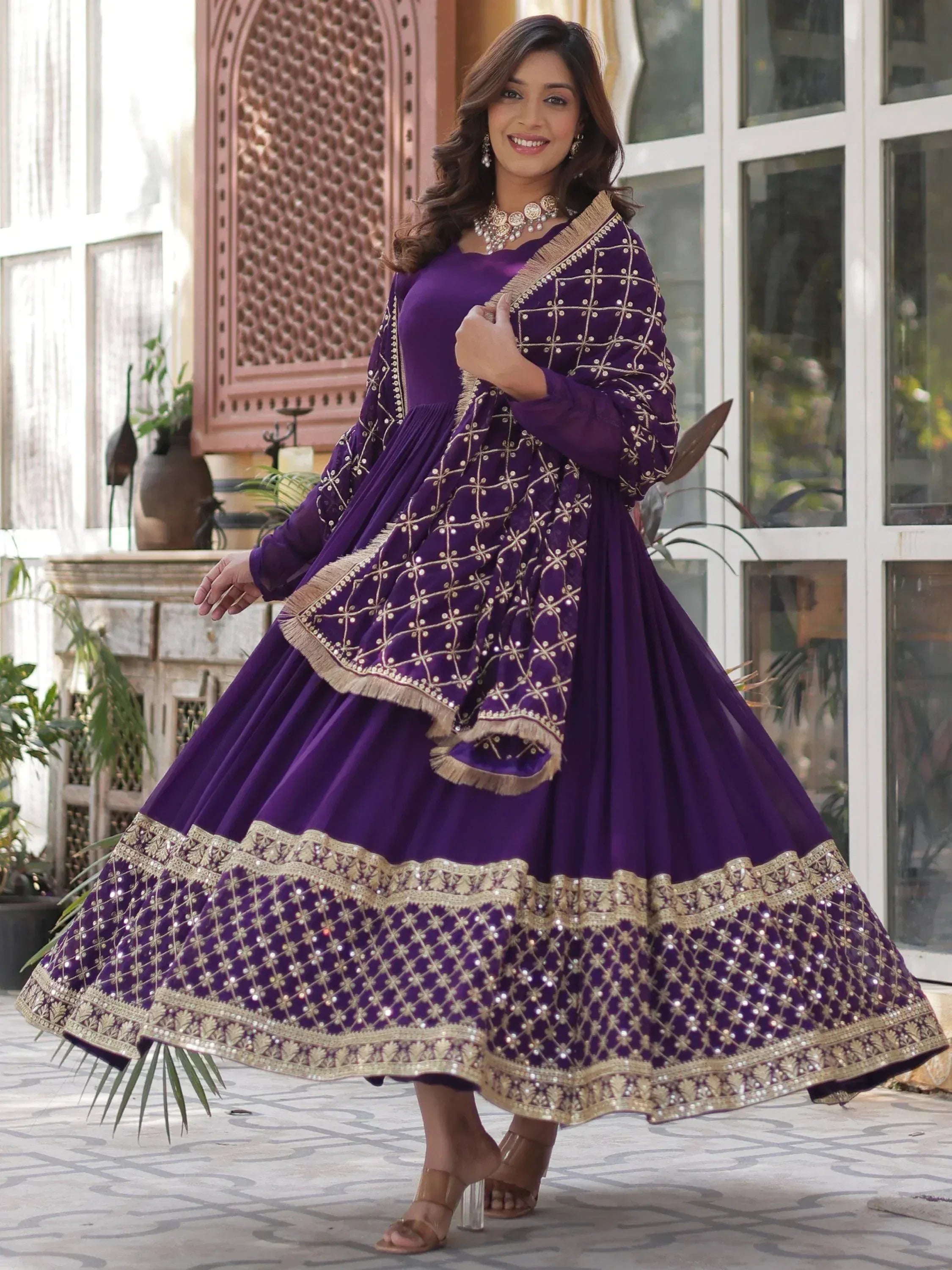 Purple Indian ethnic anarkali gown with gold embroidery and sequin work, perfect for weddings and festivals