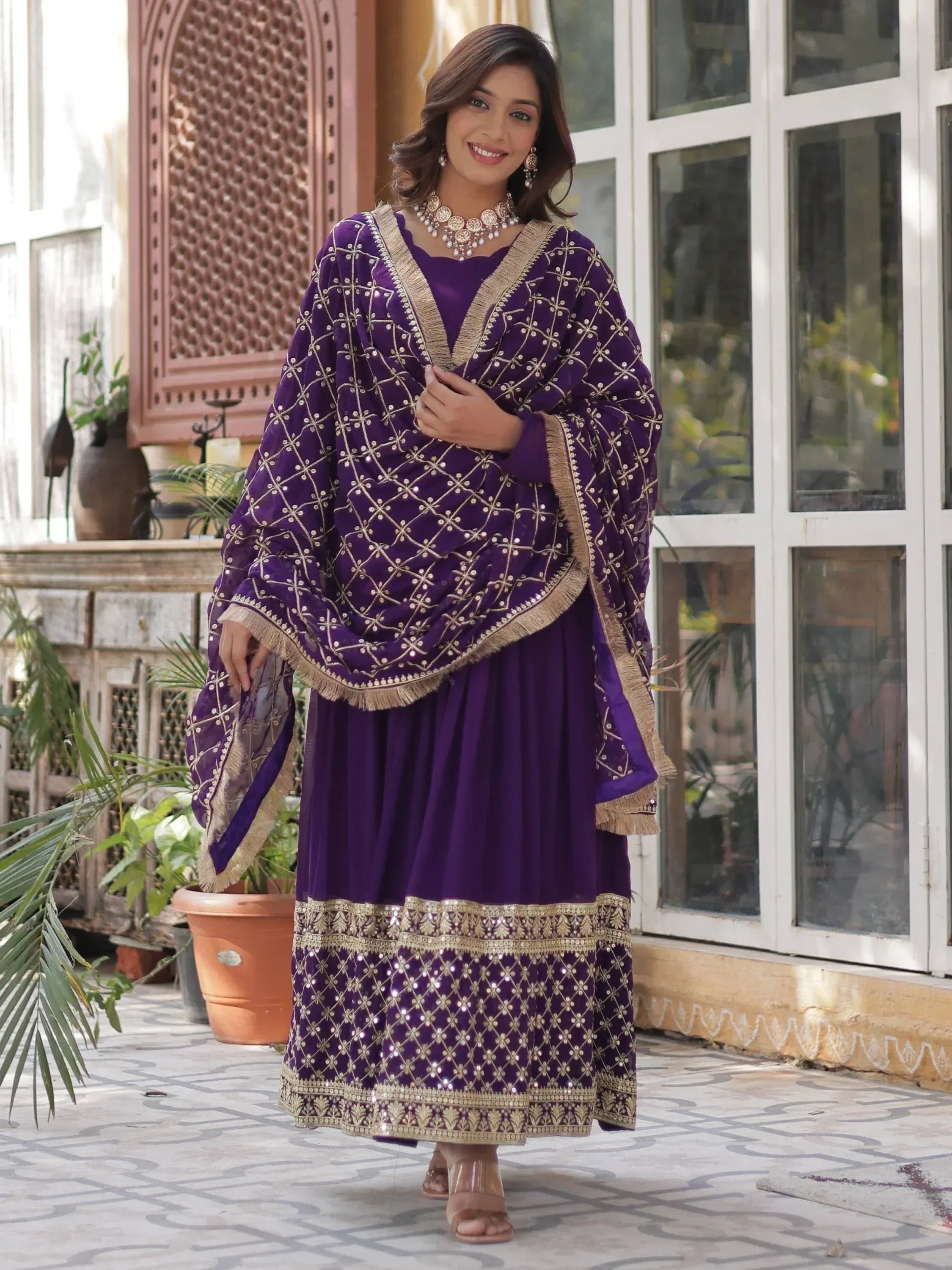 Purple embroidered salwar kameez with gold detailing, perfect for Indian ethnic wear occasions