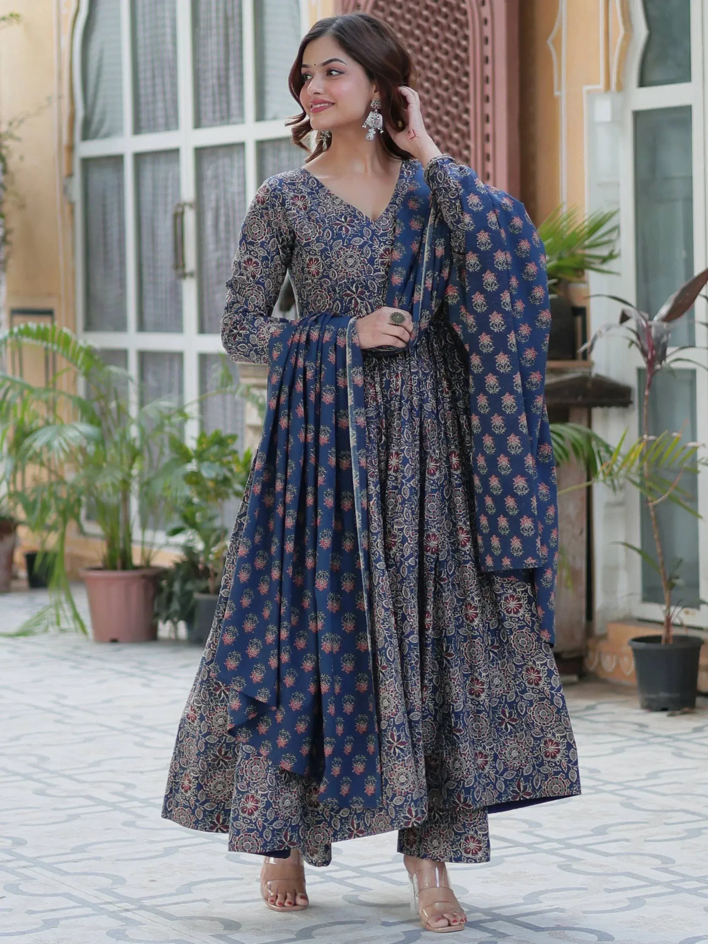 Woman in blue floral printed ethnic anarkali suit with dupatta, perfect for Indian occasions