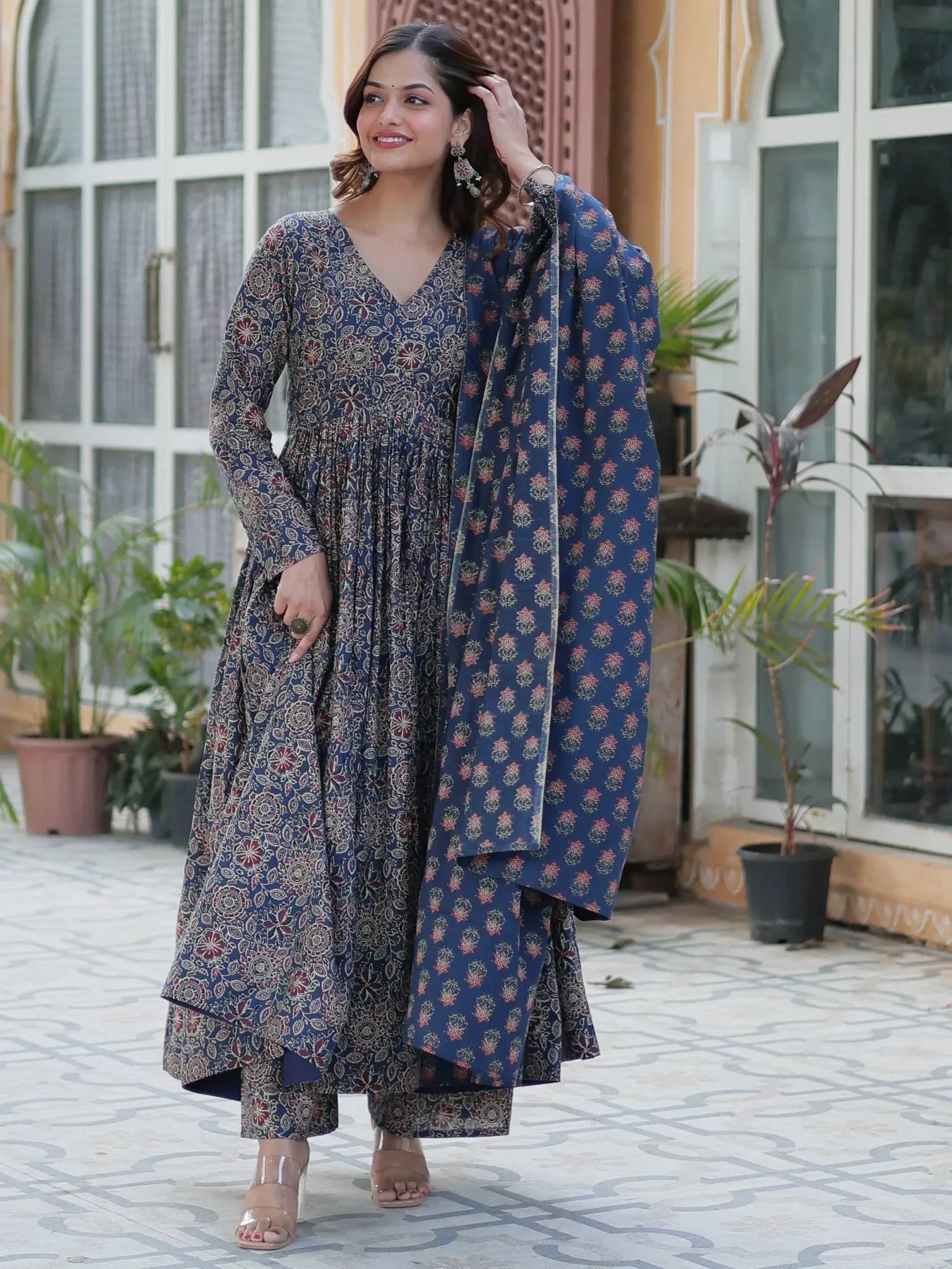 Woman in blue floral printed ethnic kurta set with matching dupatta, perfect for Indian occasions