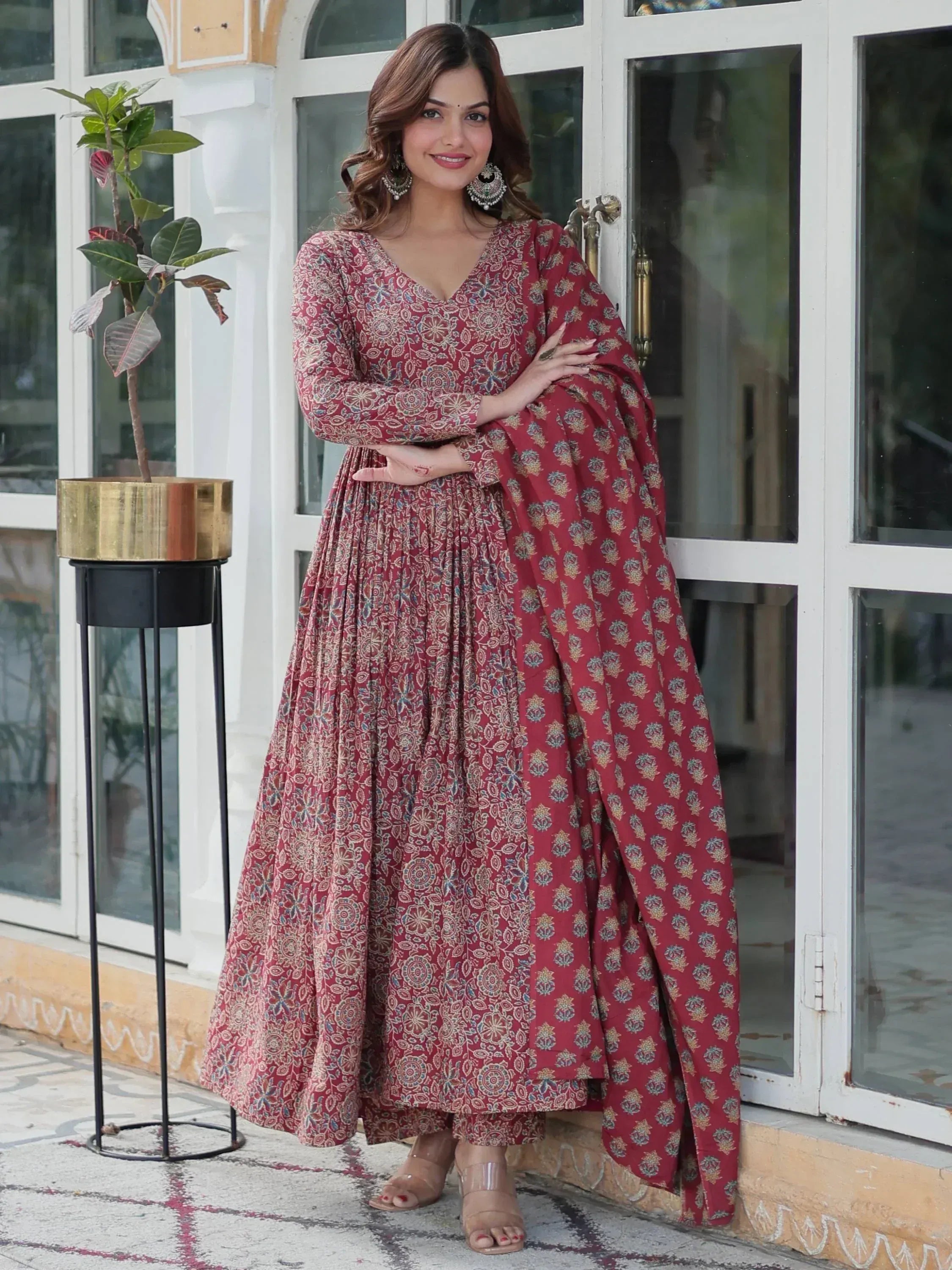 Woman in maroon floral printed anarkali suit with dupatta, ethnic Indian wear