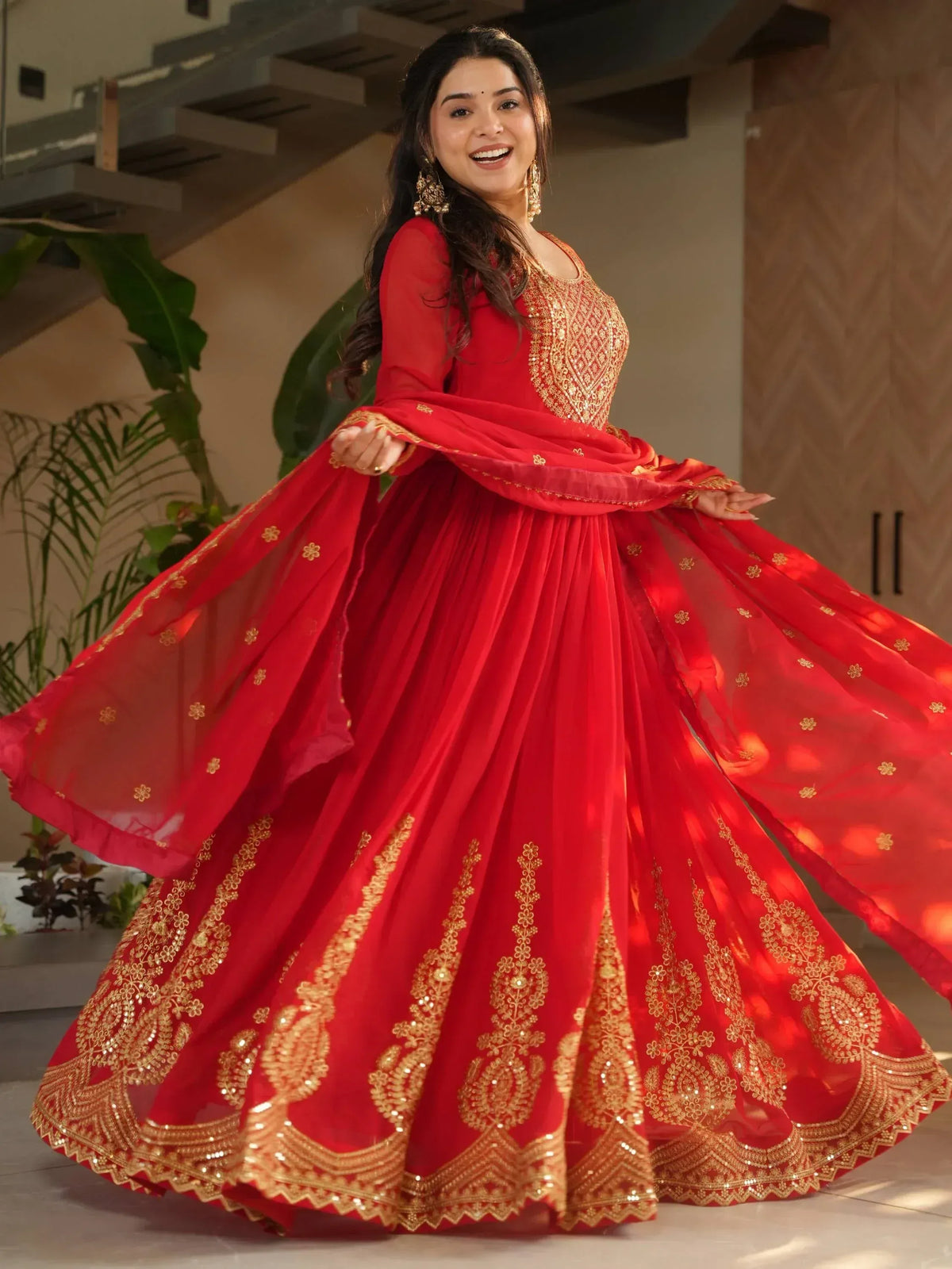 Red designer lehenga choli with gold embroidery, perfect for ethnic occasions