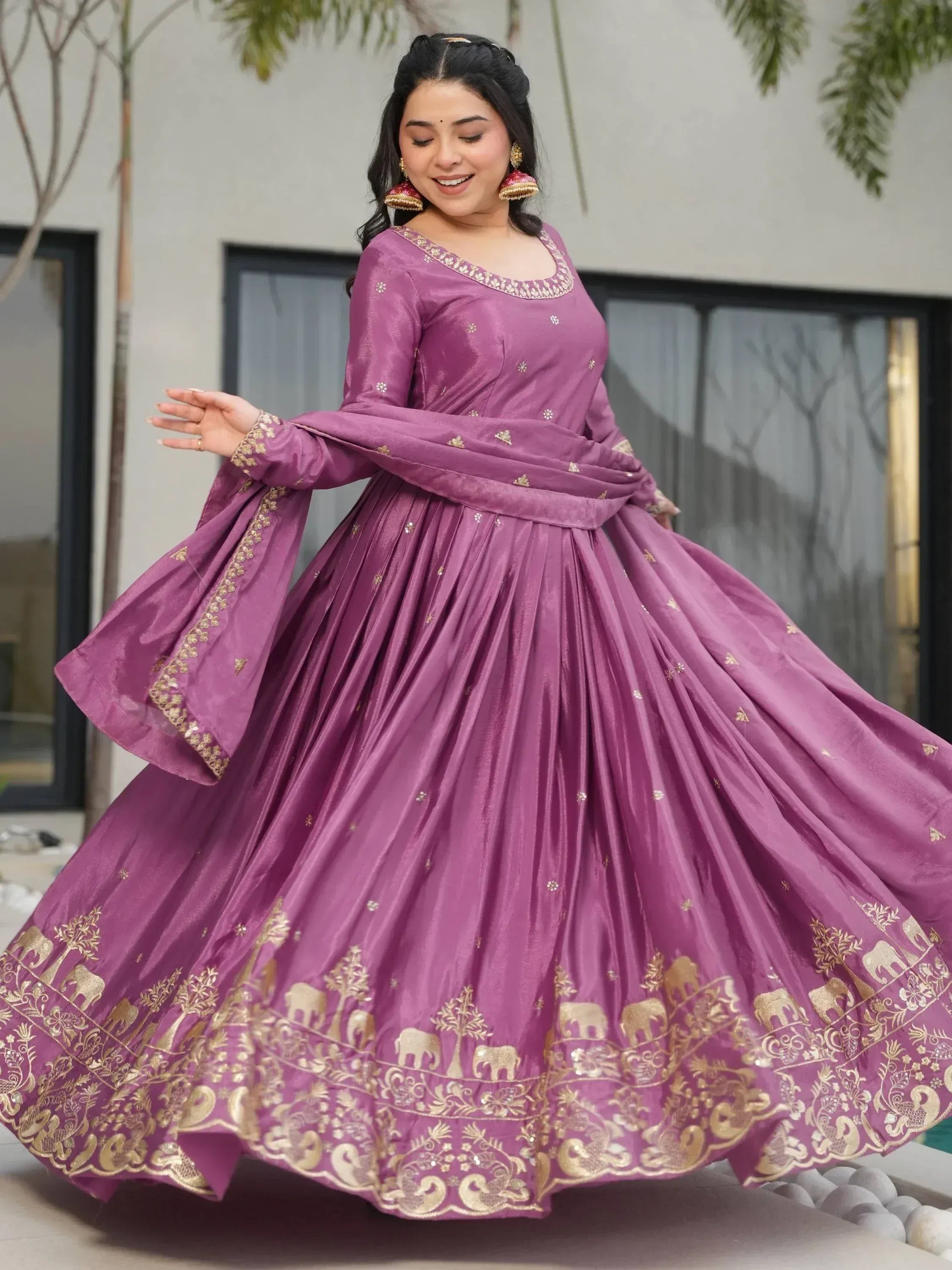Purple Indian ethnic gown with gold elephant embroidery, perfect for festive occasions and weddings.