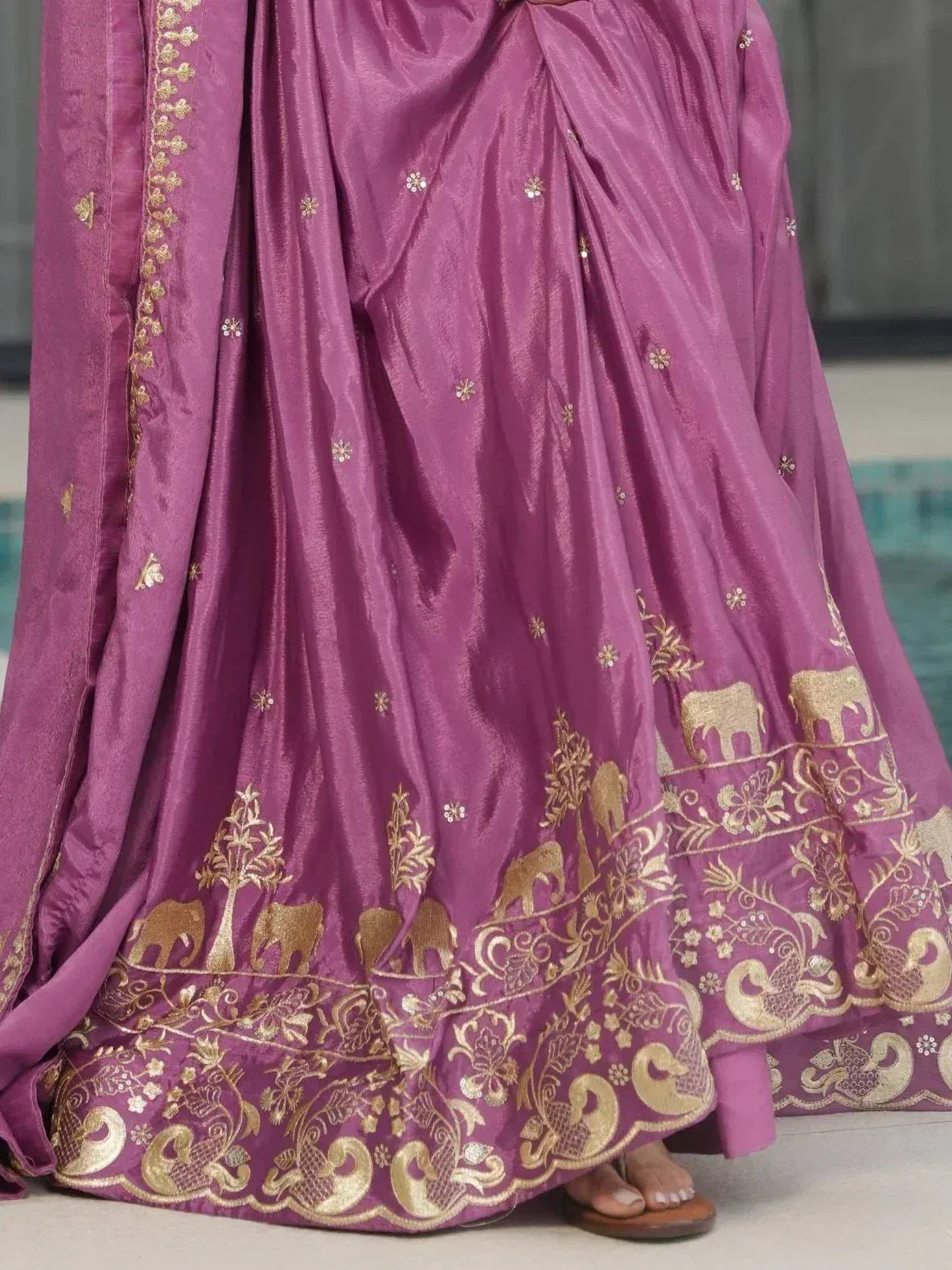 Purple lehenga with gold elephant and peacock embroidery, perfect for Indian ethnic wear occasions