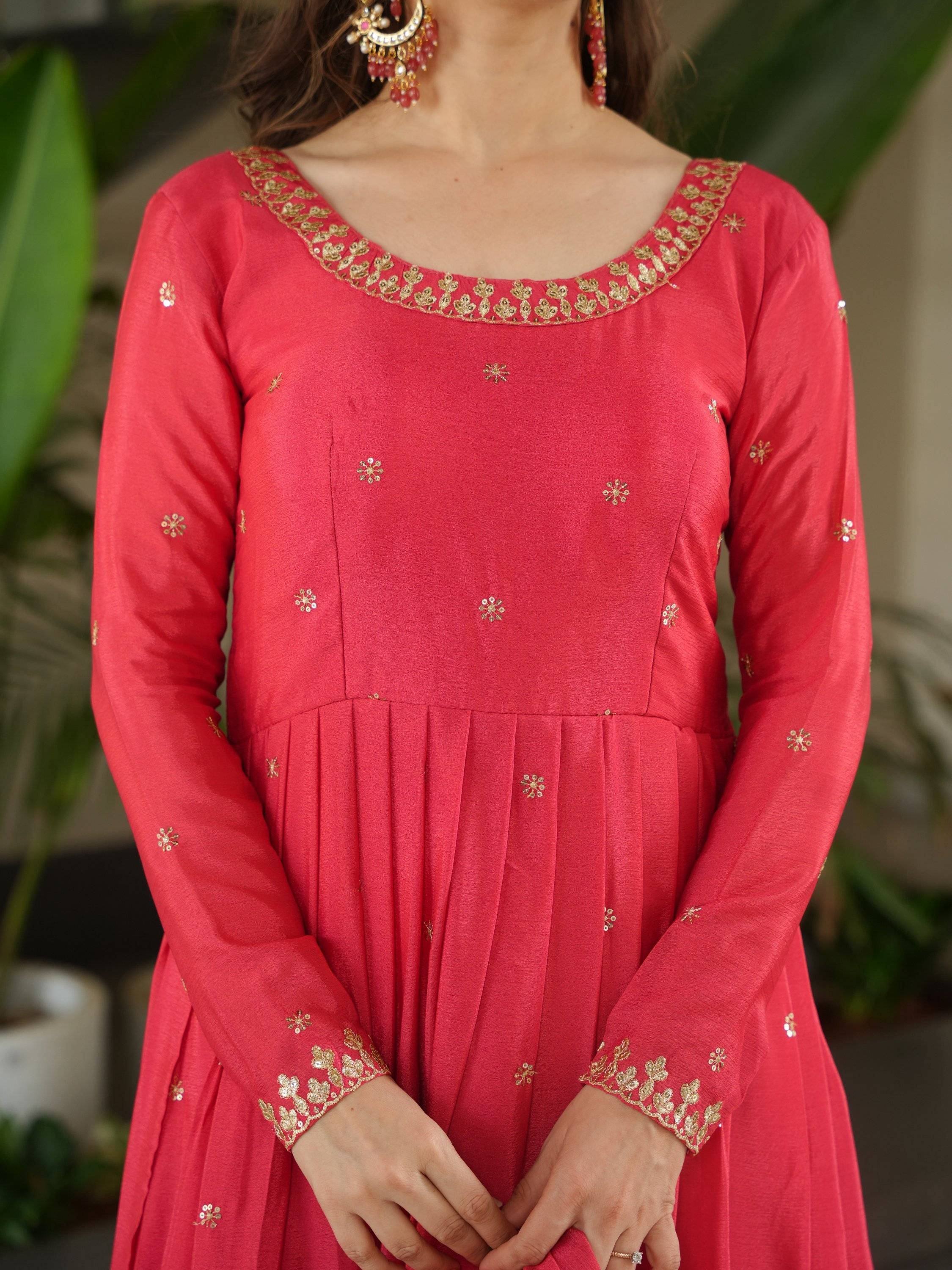 Red ethnic gown with gold embroidery and floral detailing, perfect for Indian occasions