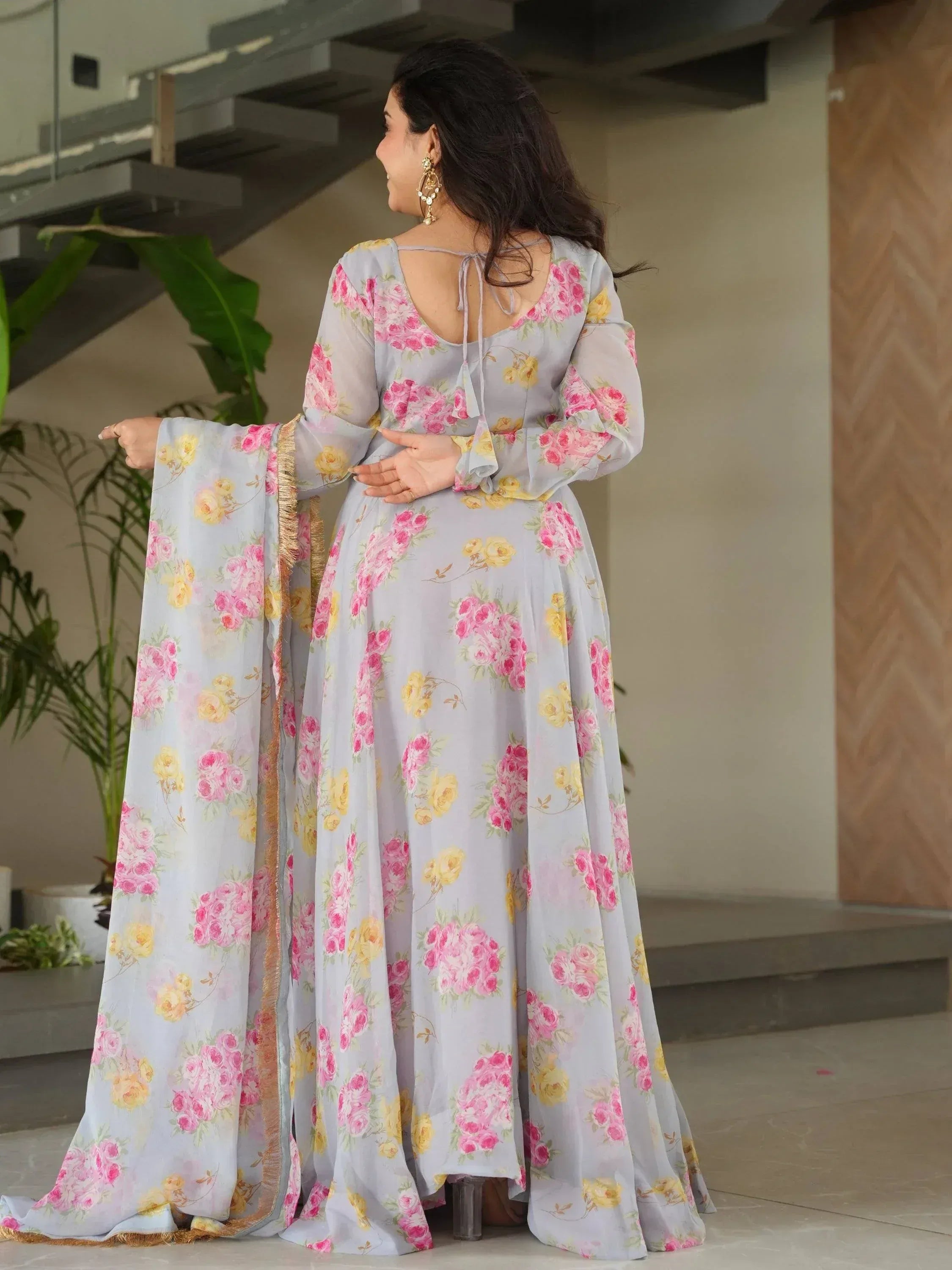 Floral print ethnic gown with bell sleeves and back tie, perfect for Indian occasions