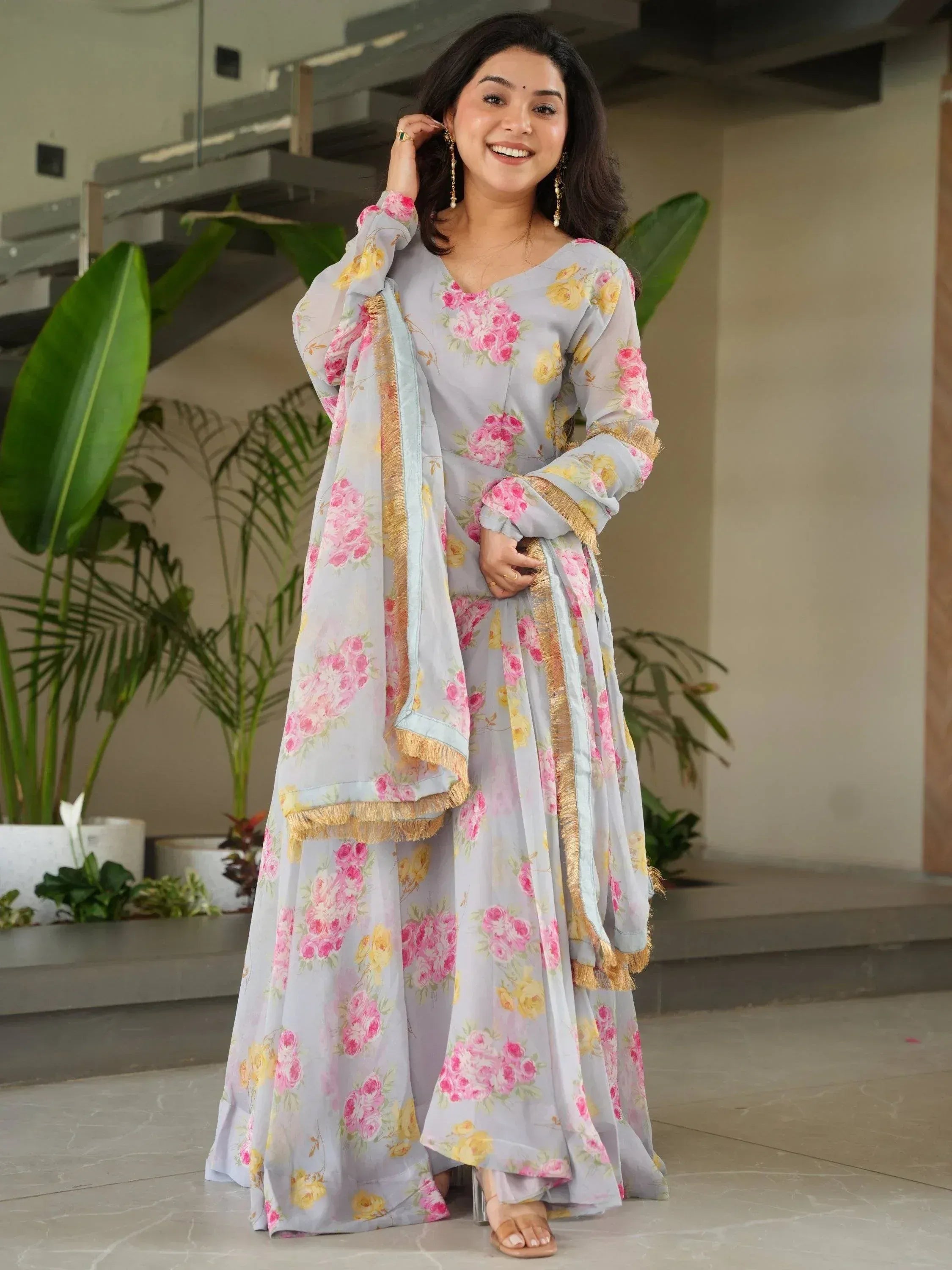 Woman in floral print salwar kameez with gold fringe, Indian ethnic wear for women