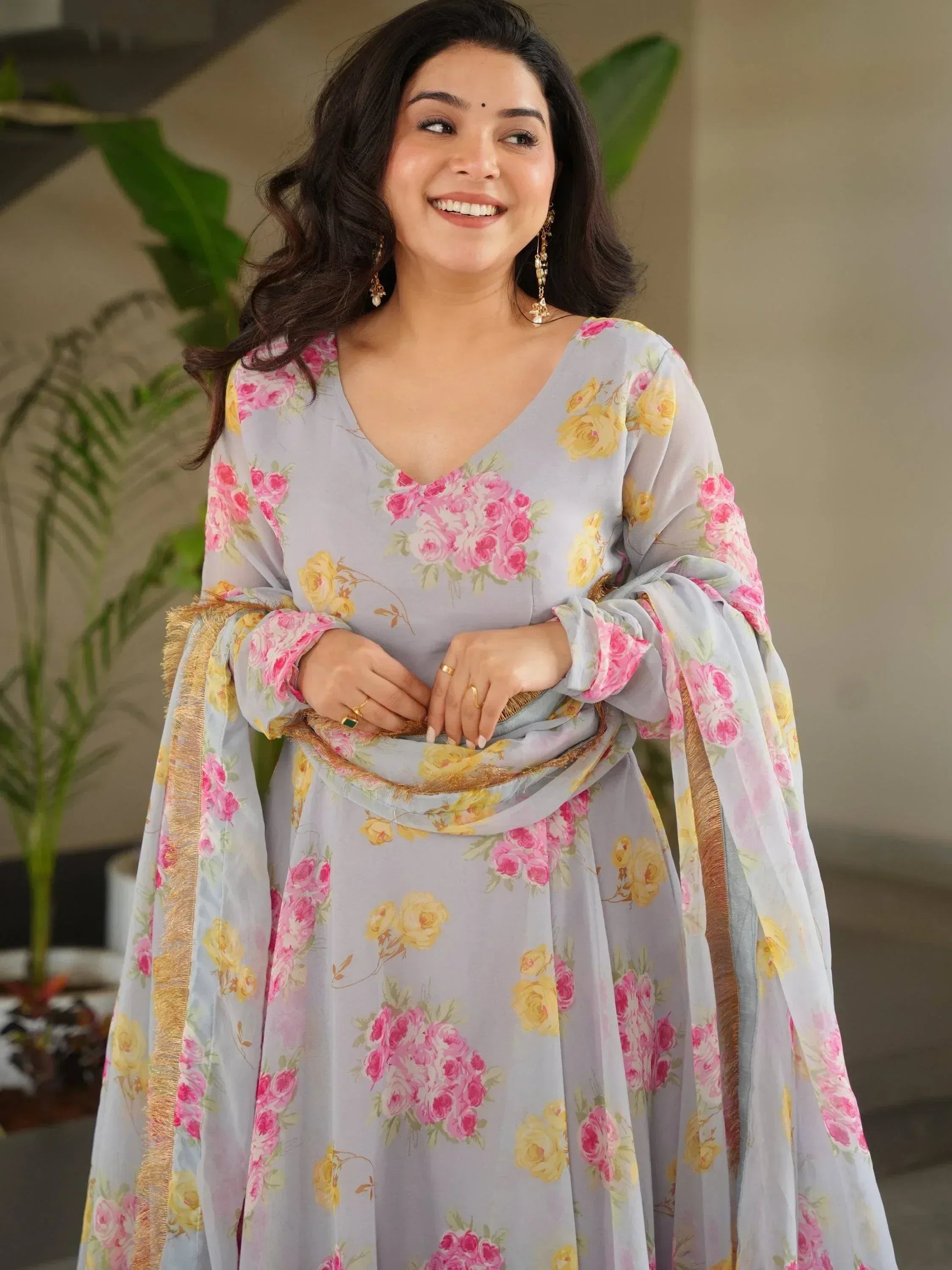 Floral print ethnic gown with gold trim, perfect for Indian occasions and festive wear