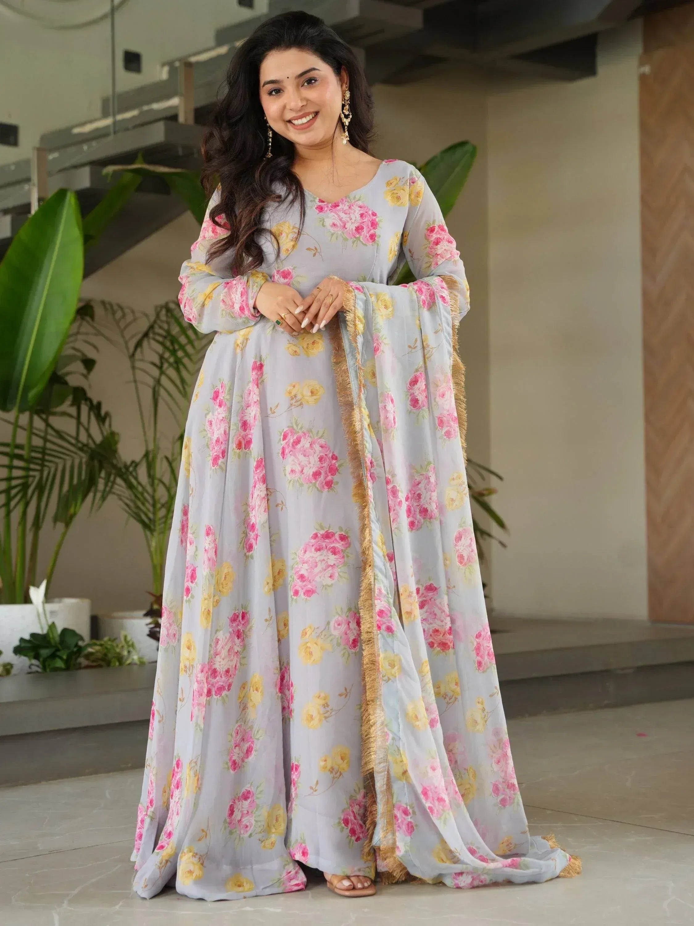 Floral print ethnic gown with gold trim, perfect for Indian occasions and festive wear