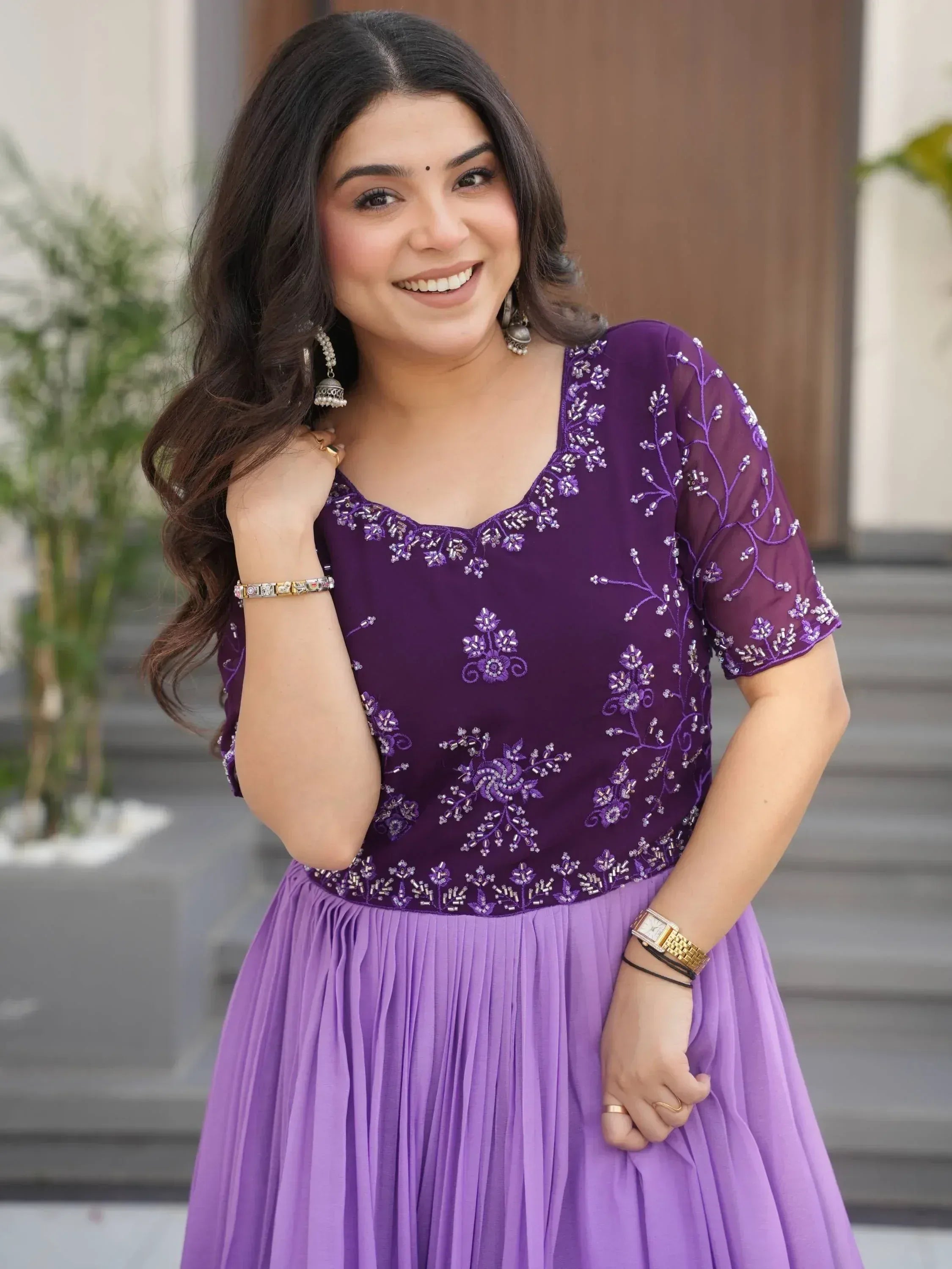 Purple embroidered ethnic gown with floral beadwork, perfect for Indian occasions and festive wear.