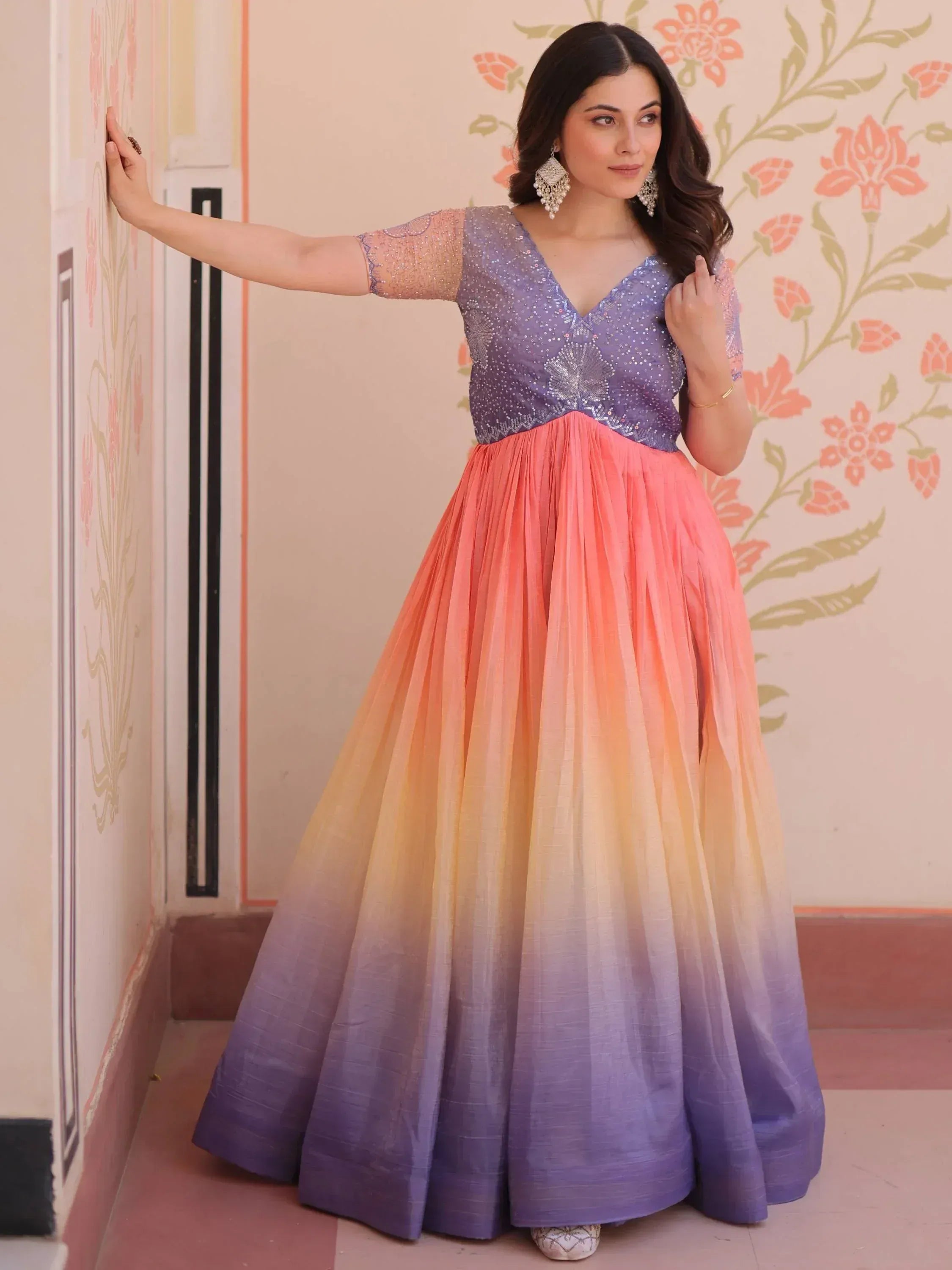 Woman in purple sequin top with ombre pink to purple pleated skirt, Indian ethnic gown