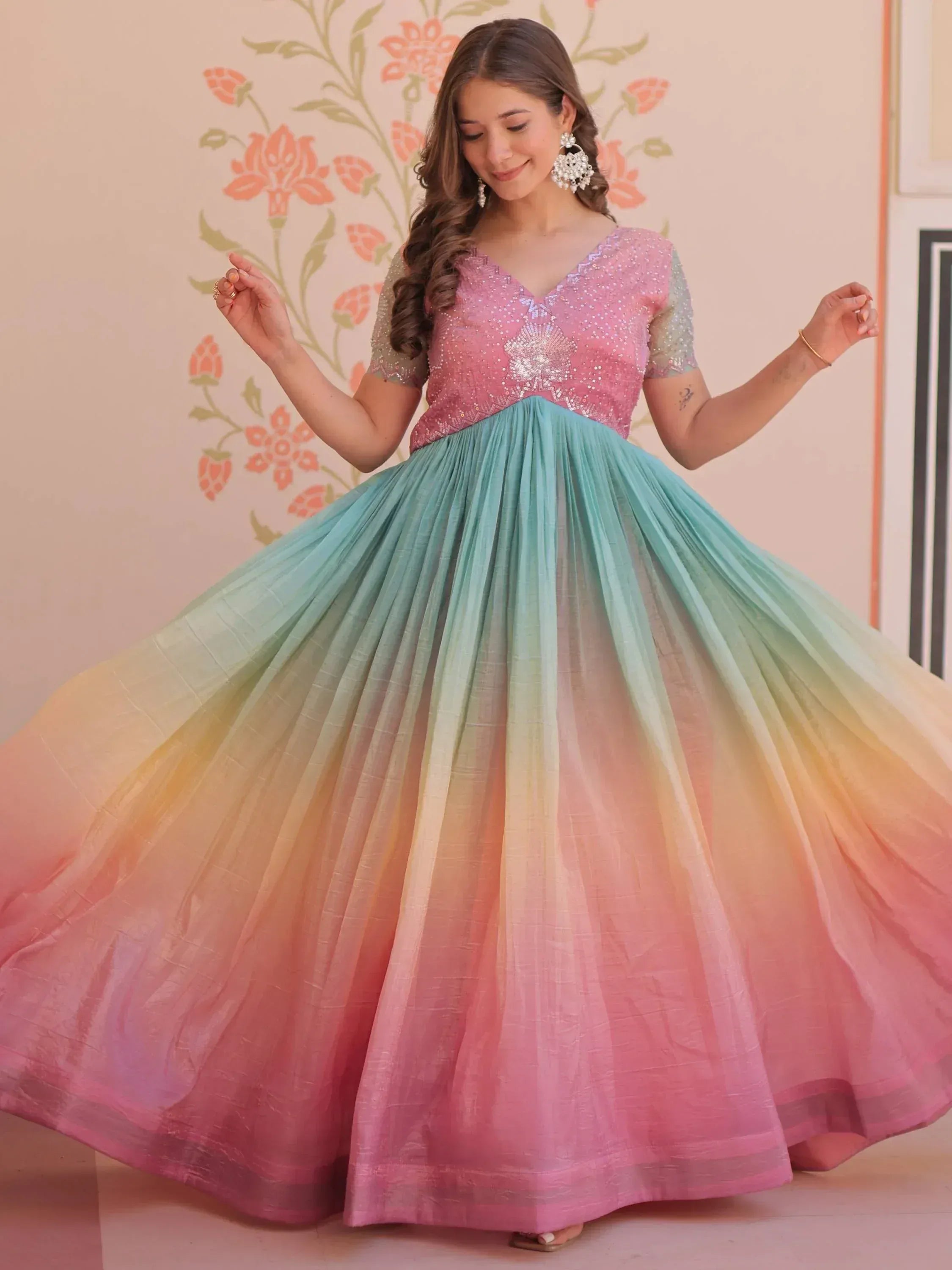 Woman in pink sequin top with rainbow ombre lehenga skirt, ethnic wear for festive occasions