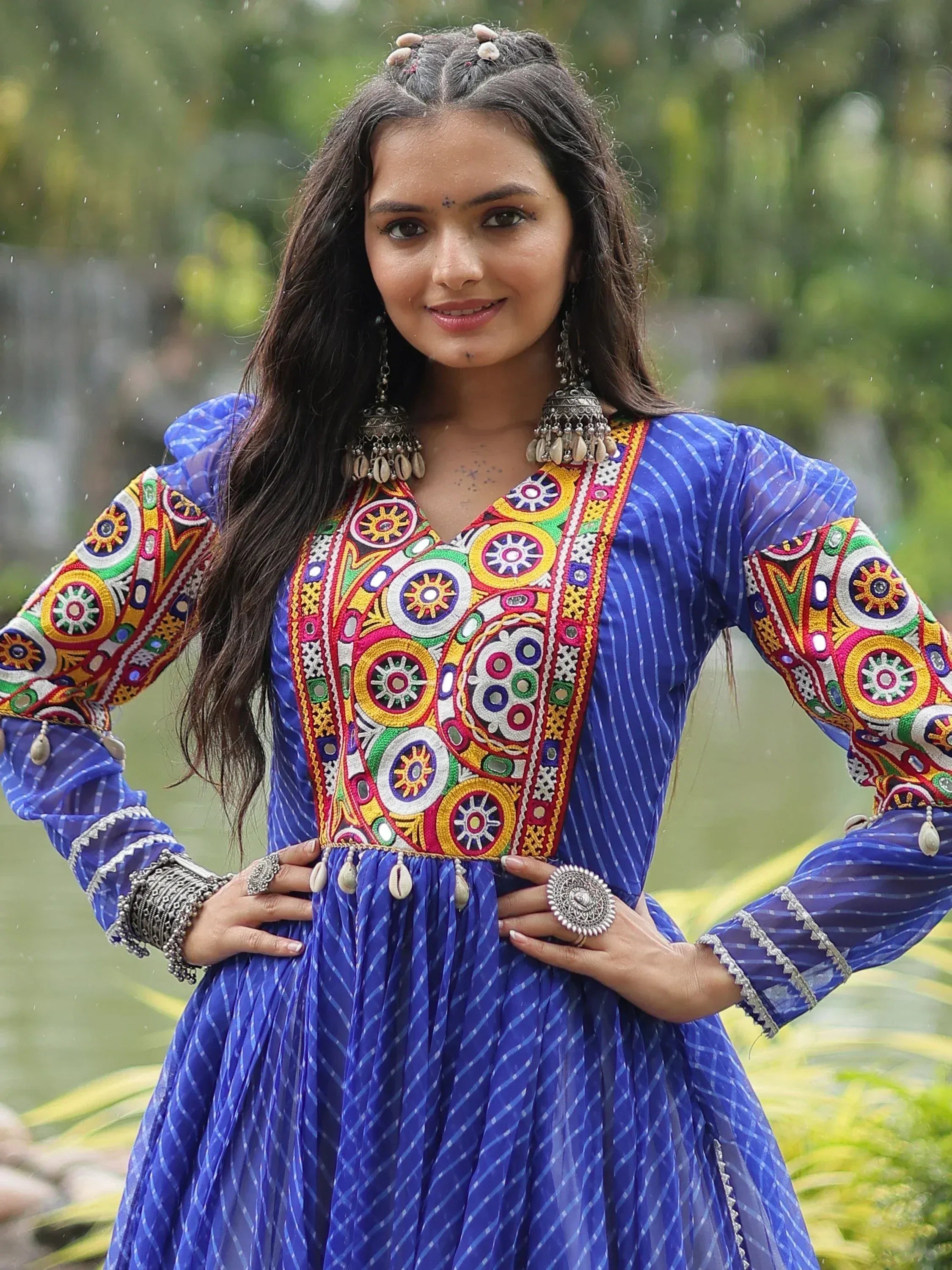 Blue embroidered ethnic gown with mirror work, perfect for Indian festivals and occasions.