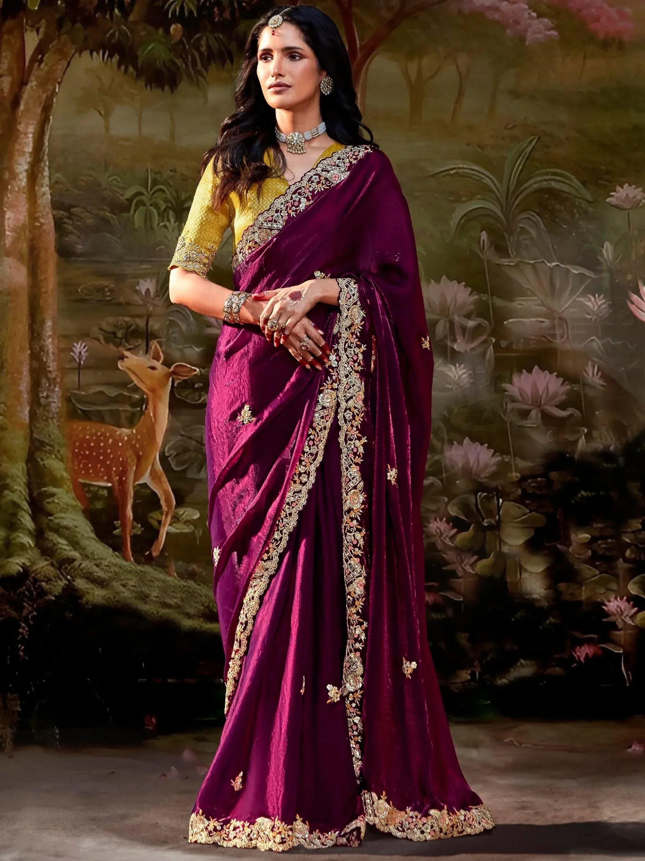 Elegant purple velvet saree with gold embroidery, paired with yellow blouse, perfect for Indian ethnic occasions.