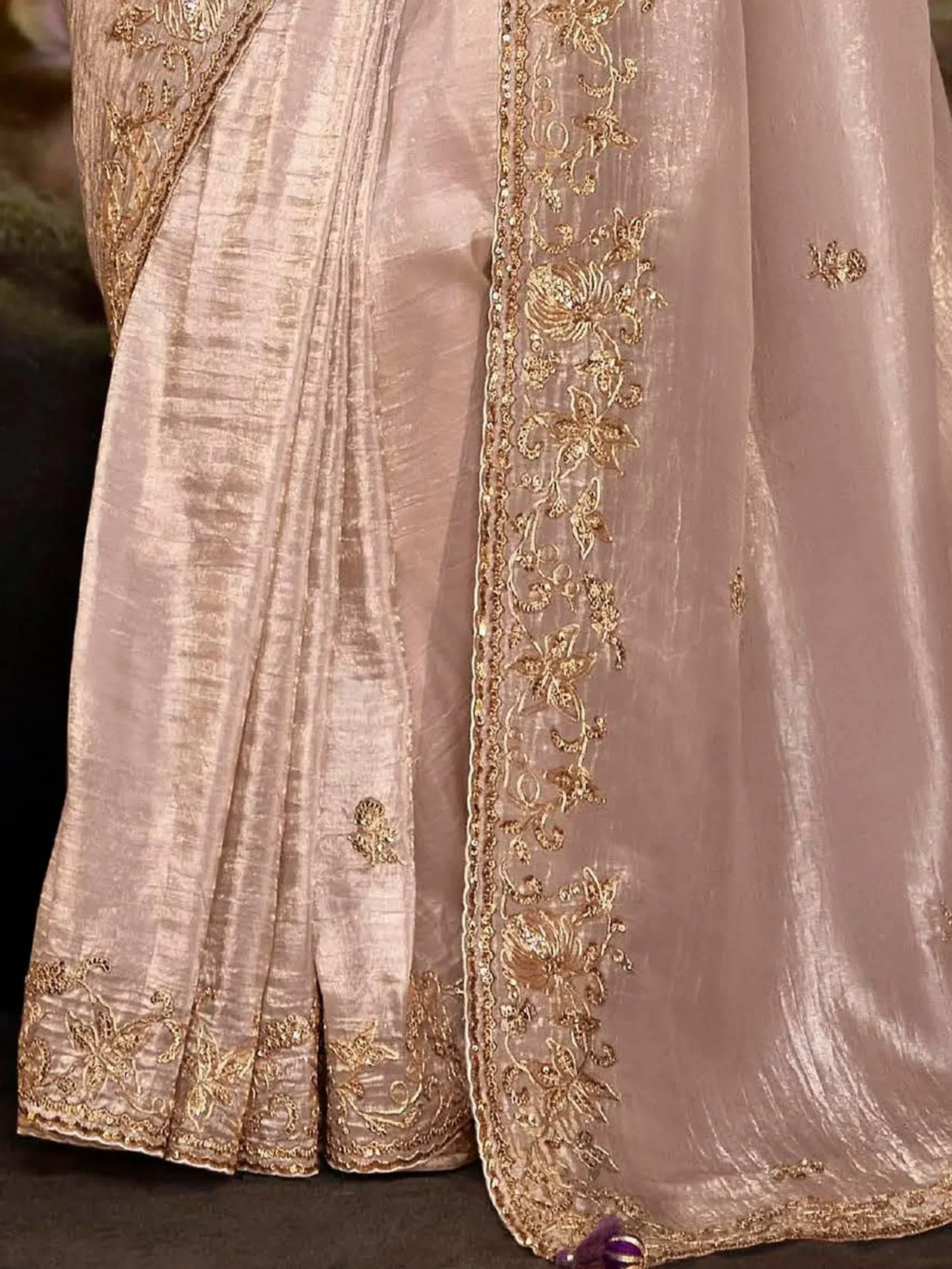 Elegant beige ethnic gown with gold floral embroidery and sequin detailing, perfect for festive occasions.