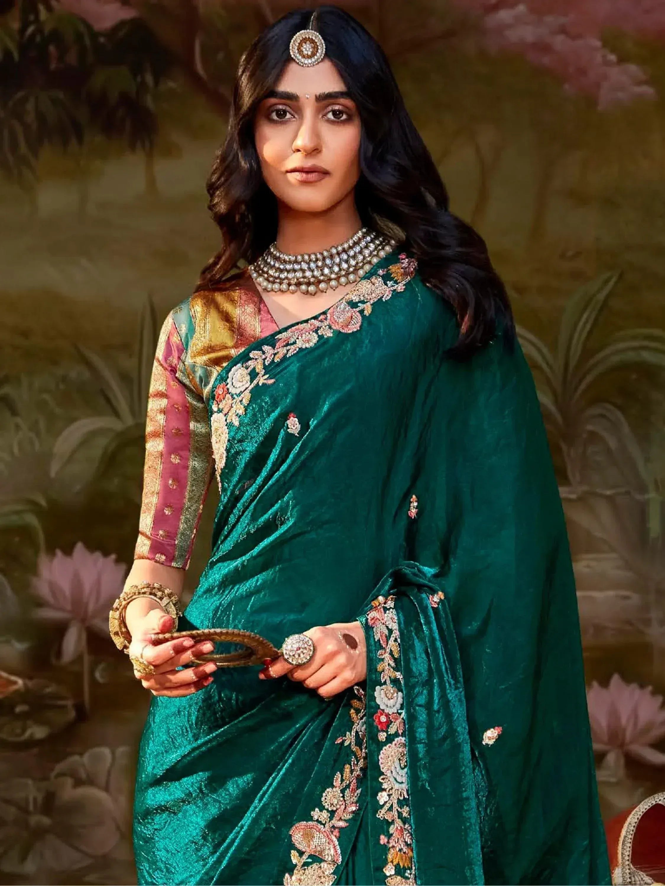 Emerald green velvet saree with floral embroidery, perfect for Indian ethnic wear and festive occasions.