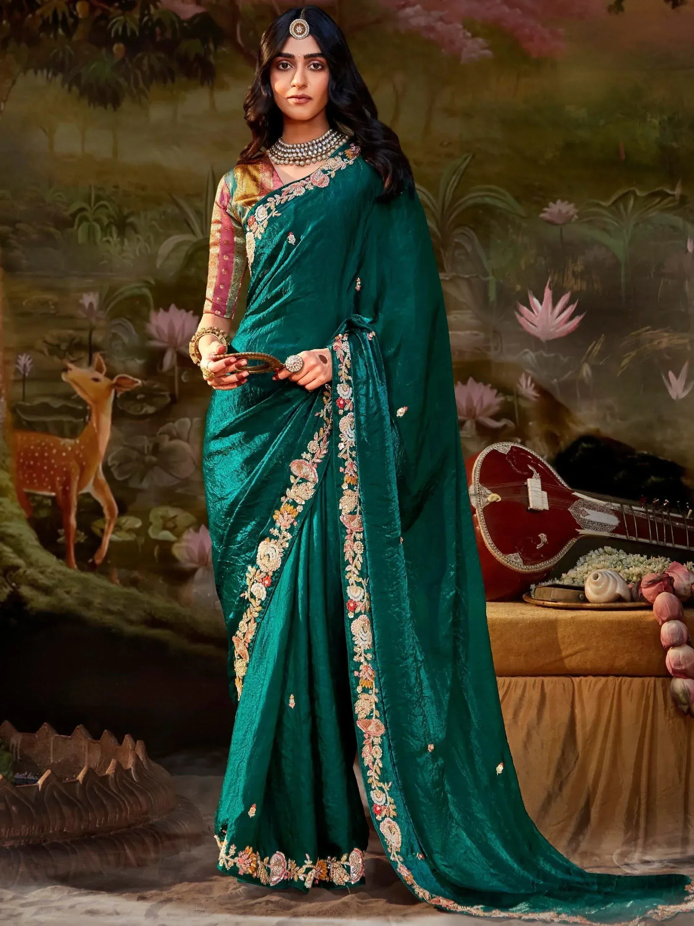 Emerald green embroidered saree with floral border, traditional Indian ethnic wear for women