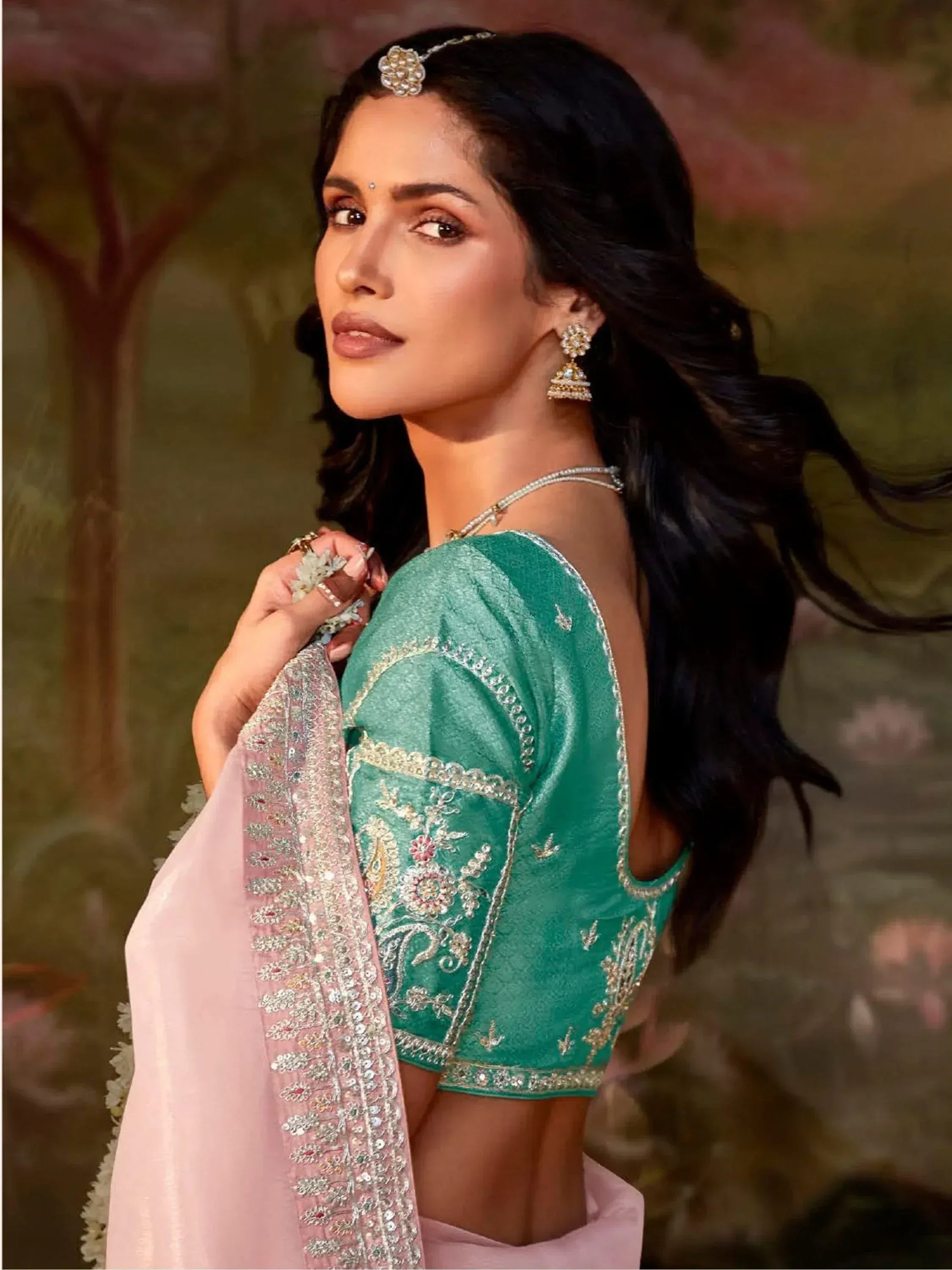 Elegant green embroidered blouse with pink dupatta, perfect for Indian ethnic wear and festive occasions.