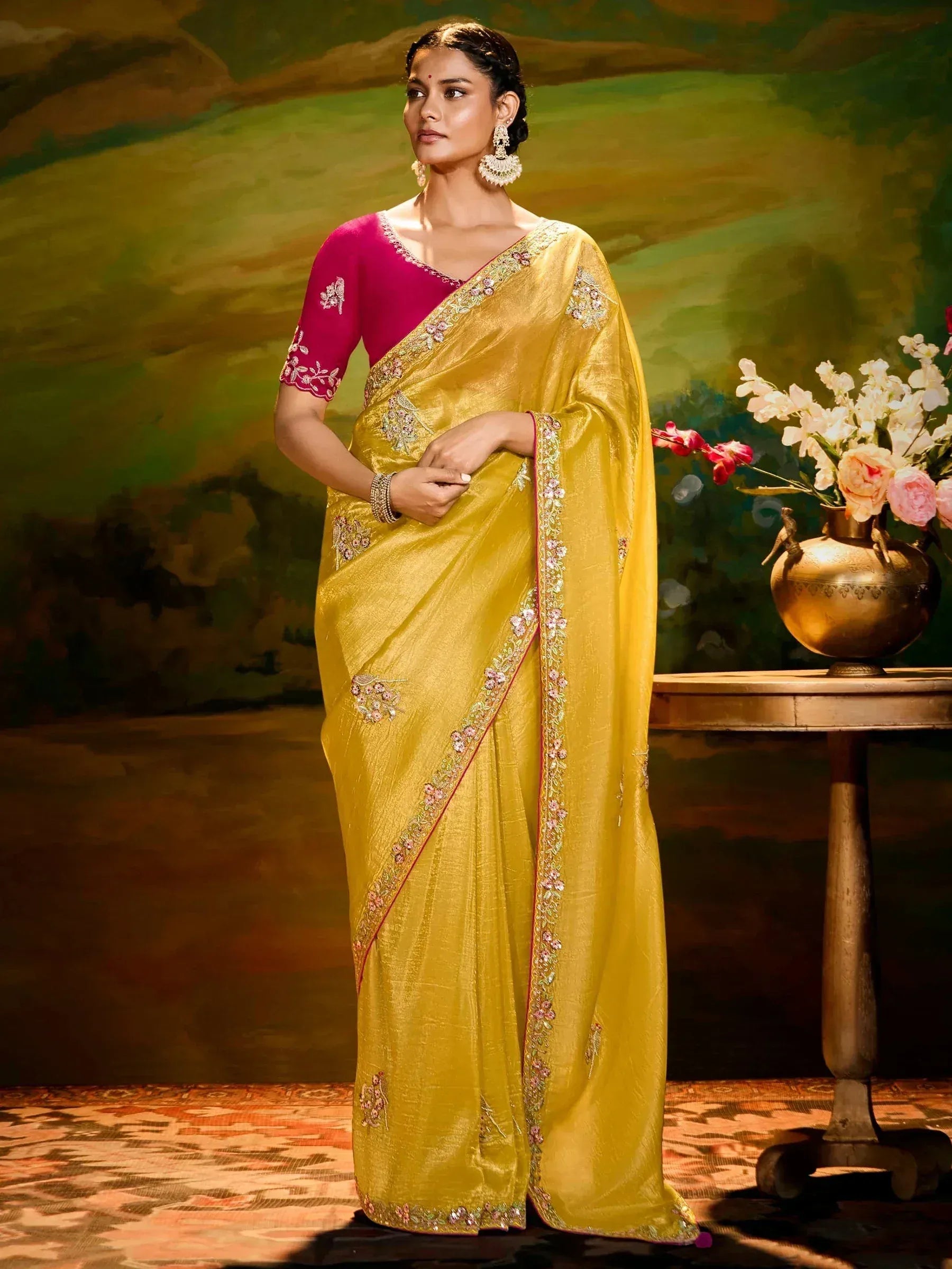 Yellow embroidered saree with pink blouse, perfect for Indian ethnic wear occasions