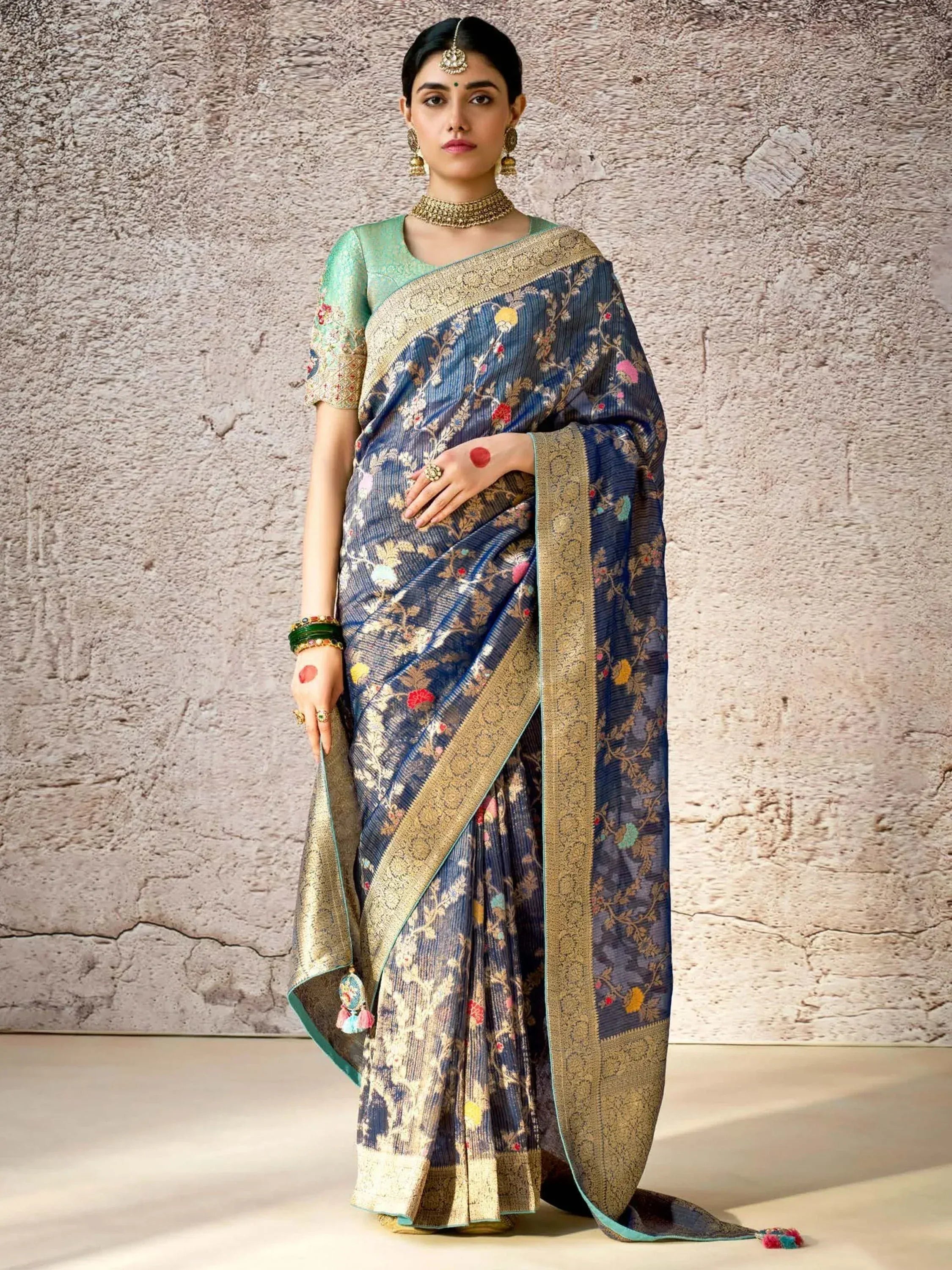 Blue floral embroidered saree with gold border and mint blouse, traditional Indian ethnic wear