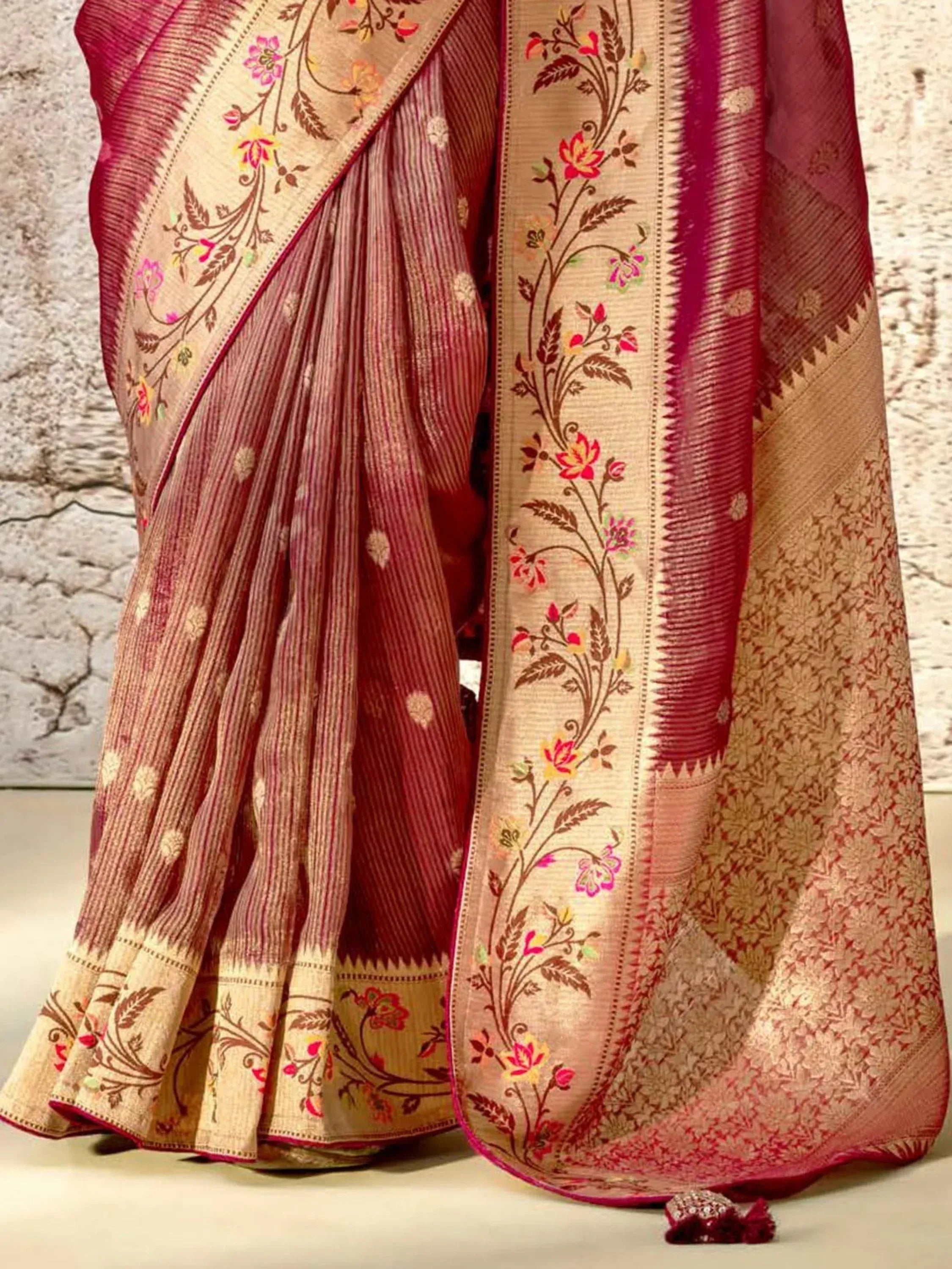 Elegant maroon and gold saree with floral embroidery, perfect for Indian ethnic wear occasions